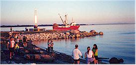 A fishing boat passing by Garry Point Park