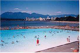 Kitsilano pool with Kitsilano Beach, the North Shore Mountains, and Vancouver's West End in the background