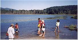 Kids along the lake shore looking for the "world biggest tadpoles"