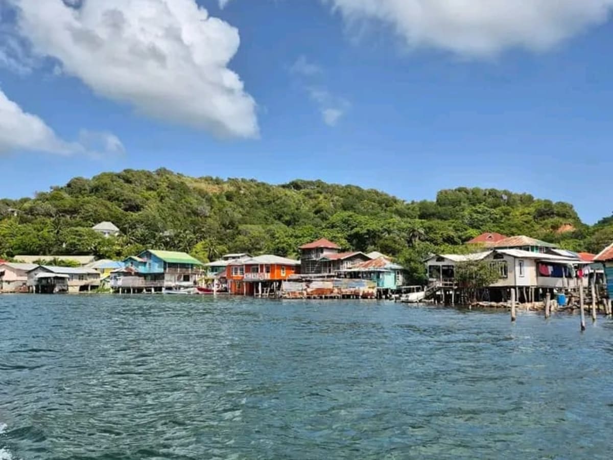 Oak Ridge stilt village on Roatán's east end, reached with a private driver