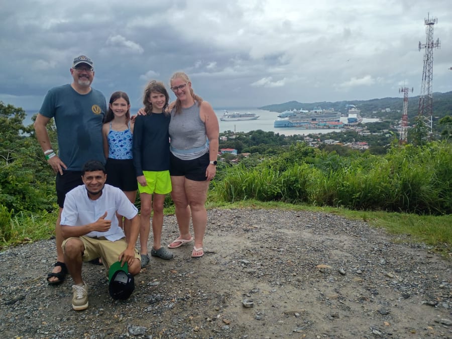 Guests with their driver at an ocean-view stop