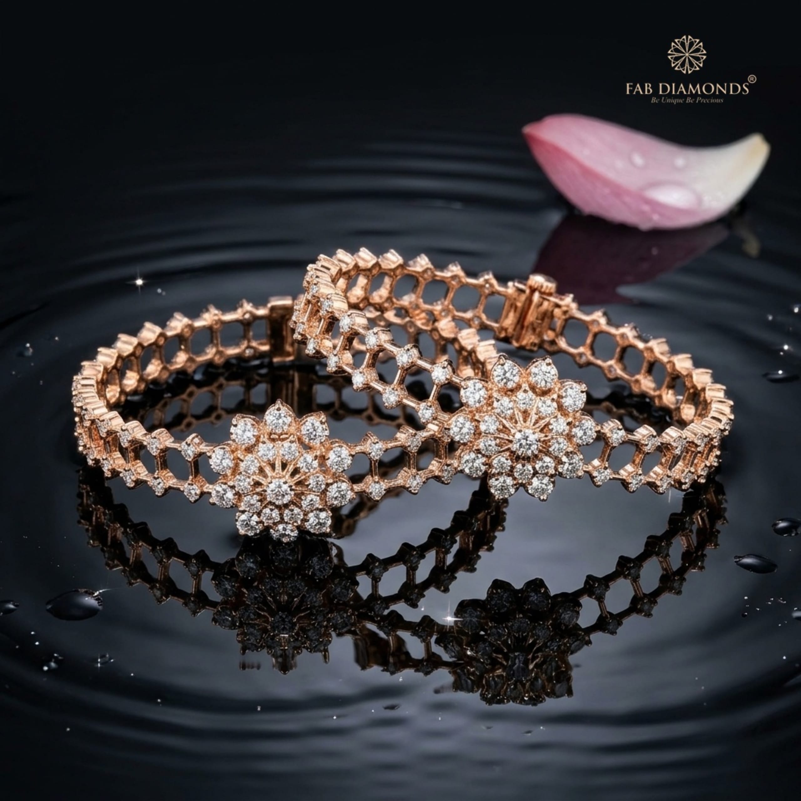 A pair of 18KT gold bangles with double-row diamond lattice and sunburst clusters