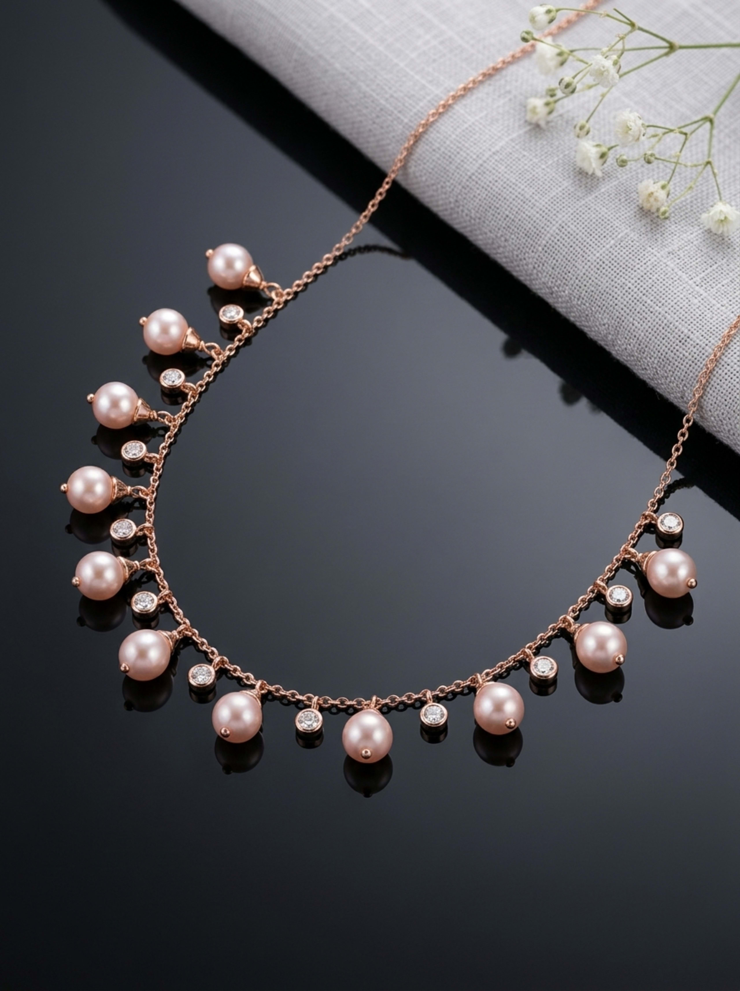 Blush Pearl and Diamond Fringe Station Chain in 18KT rose gold on glossy black surface