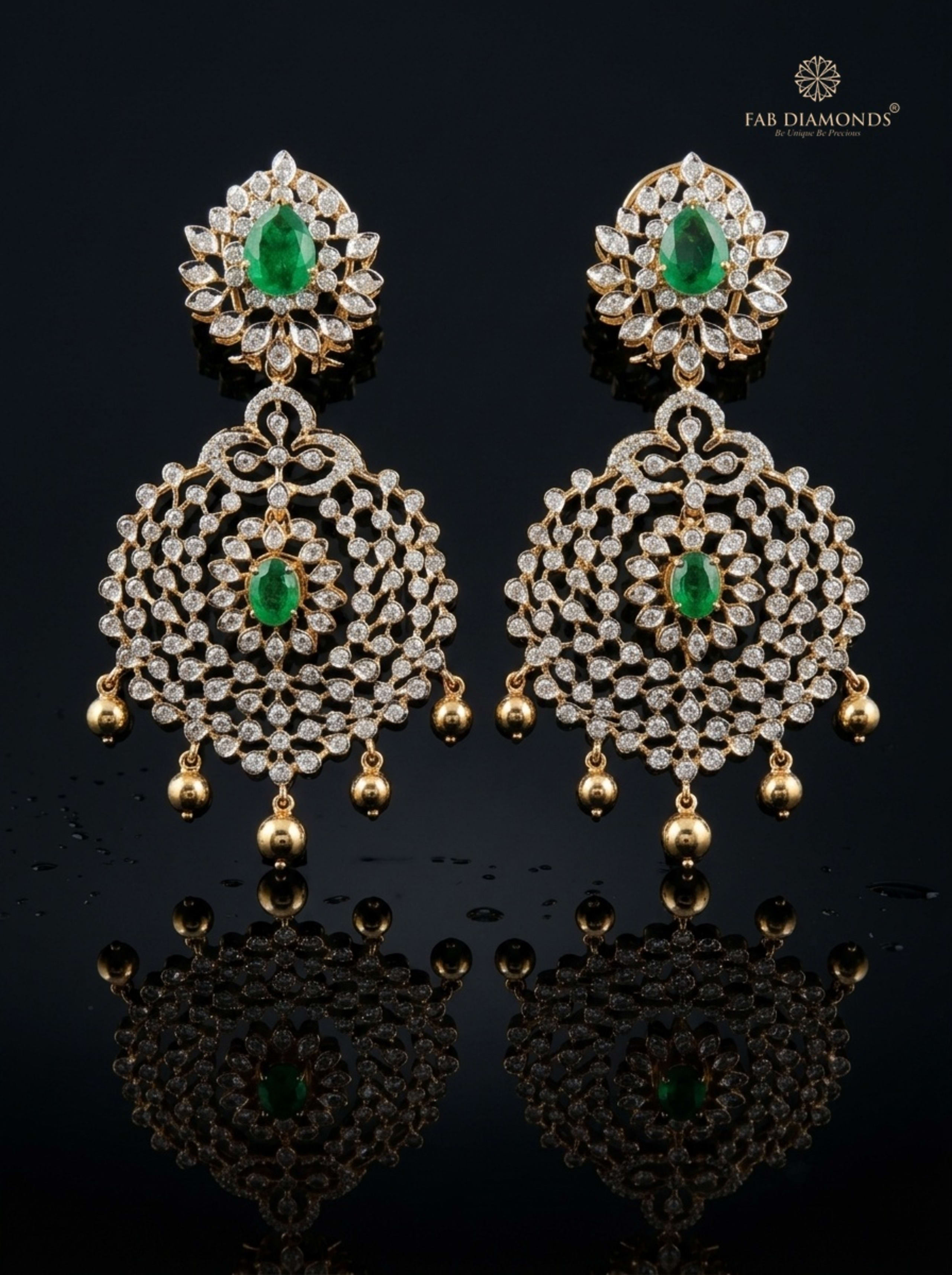 Concentric Emerald and Diamond Chandbali Earrings on champagne silk cushion