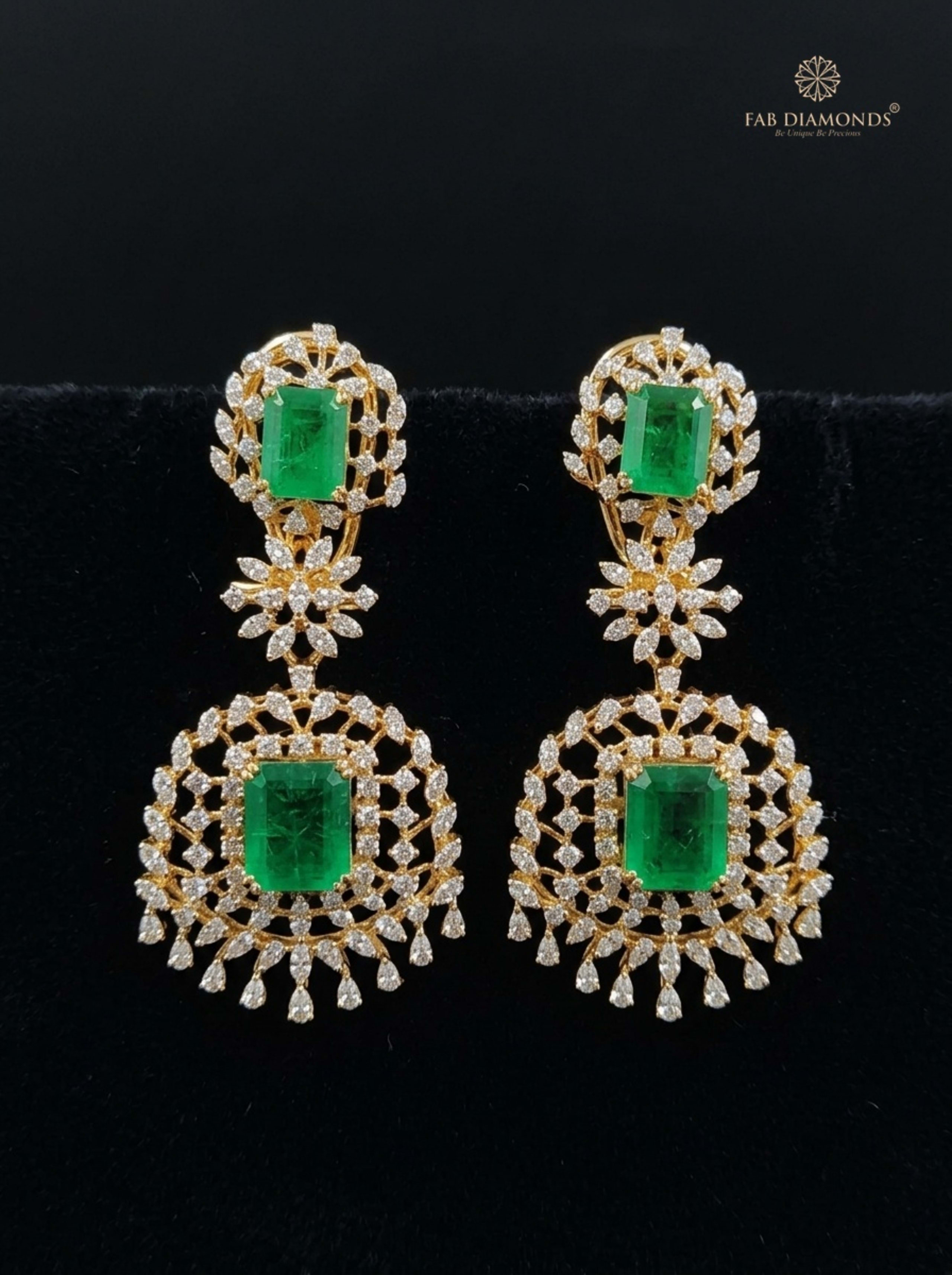 Emerald Shield and Diamond Plume Ear Climber Chandelier on rustic dark wood