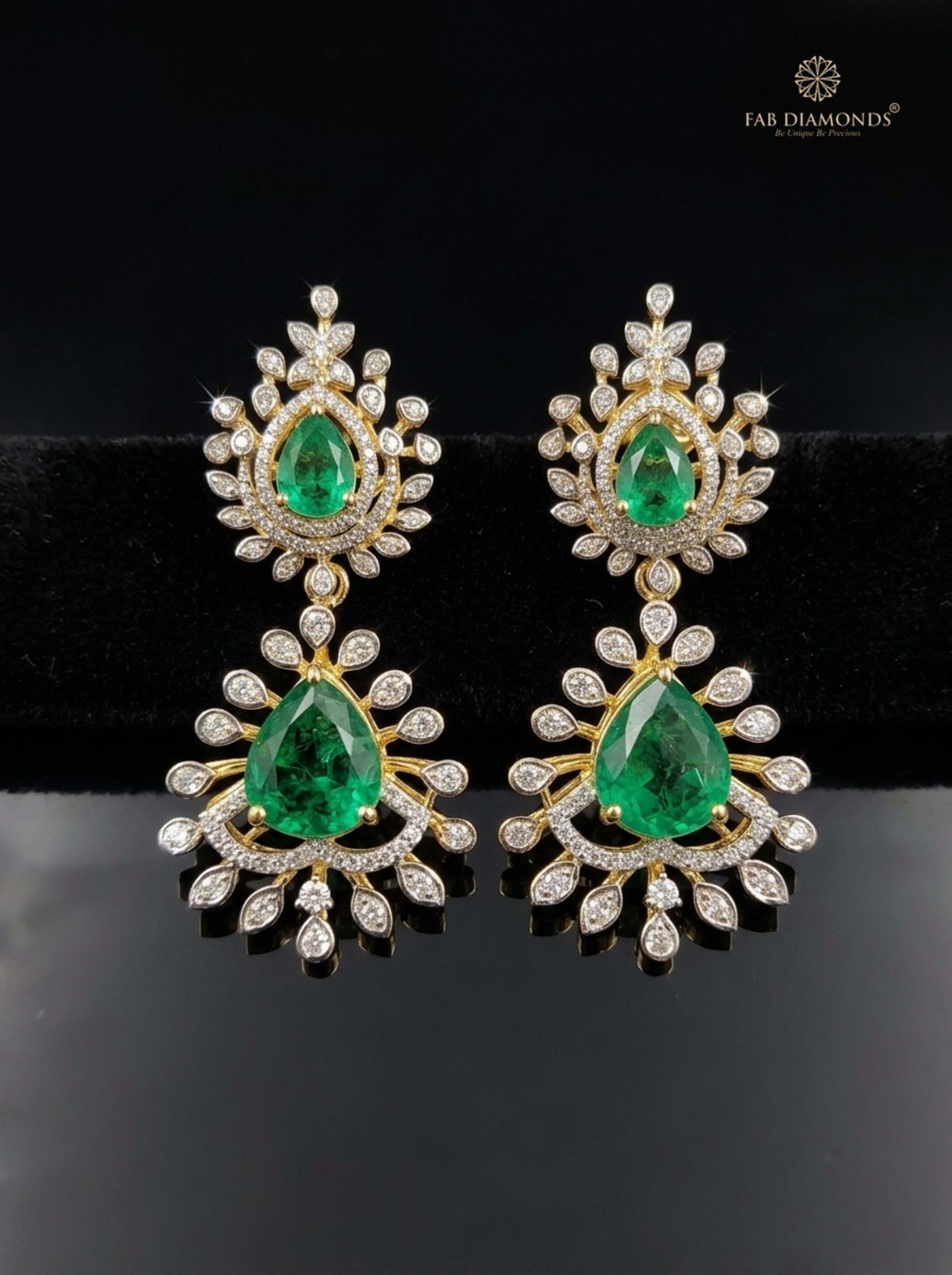 Shield Emerald and Arabesque Diamond Chandelier Earrings on matte black surface