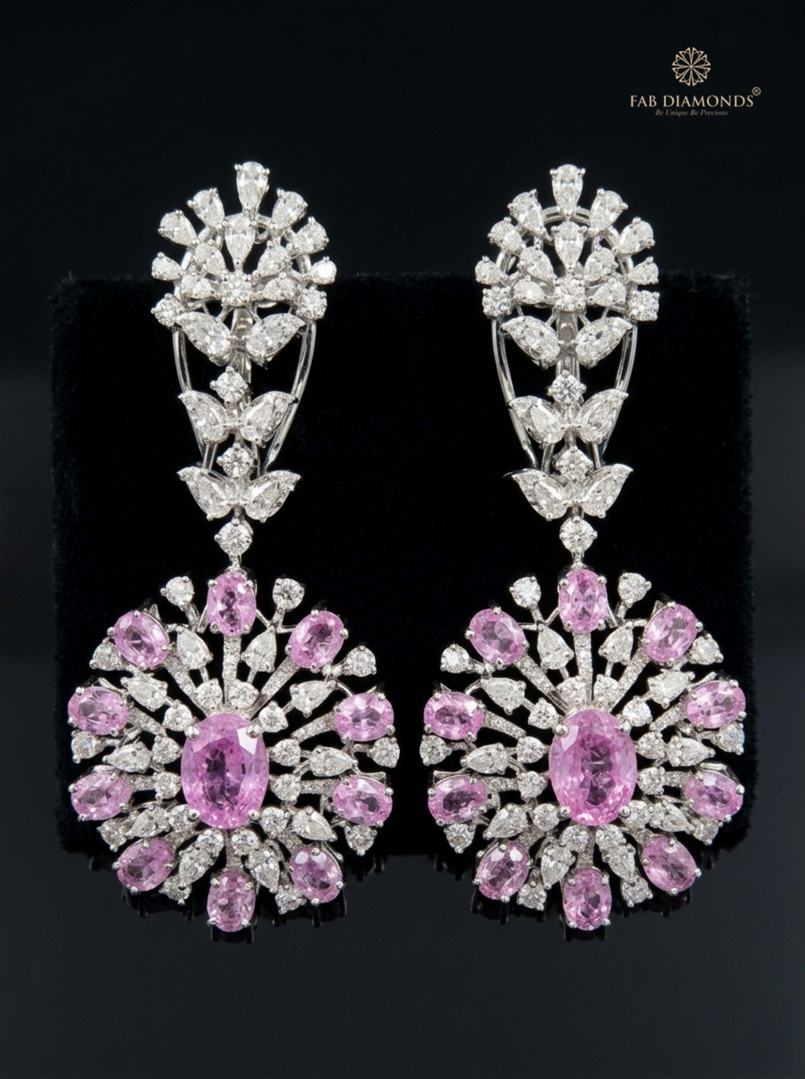 Emerald-Cut Emerald and Radiant Pink Pota Drop Earrings on champagne silk cushion
