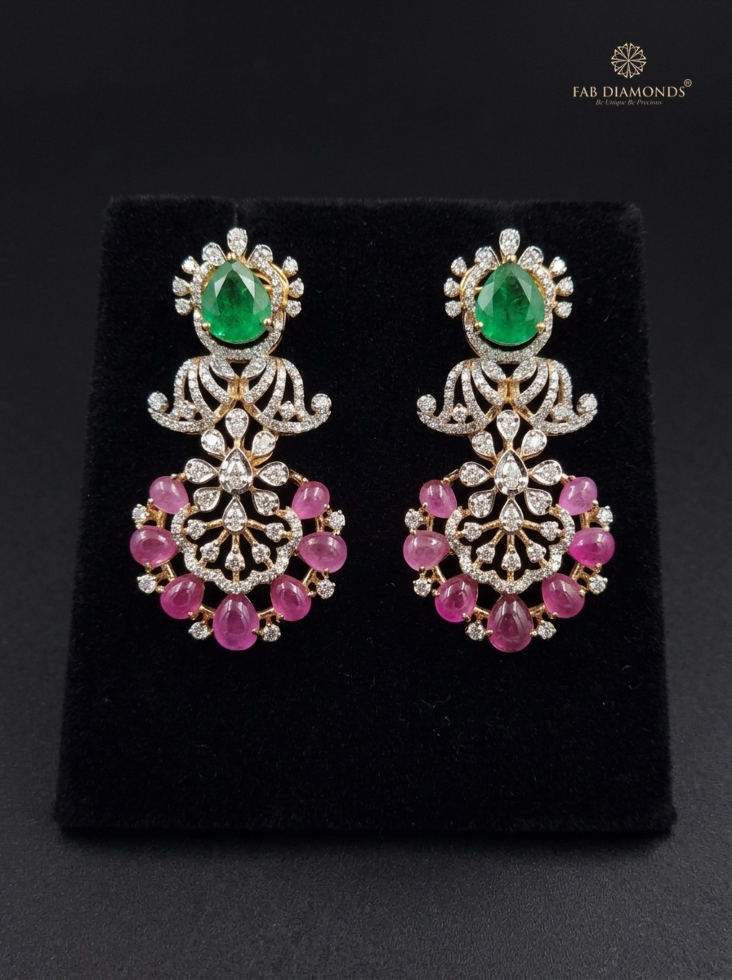 Tanzanite Emerald-Cut and Lavender Briolette Chandelier Earrings on silk cushion