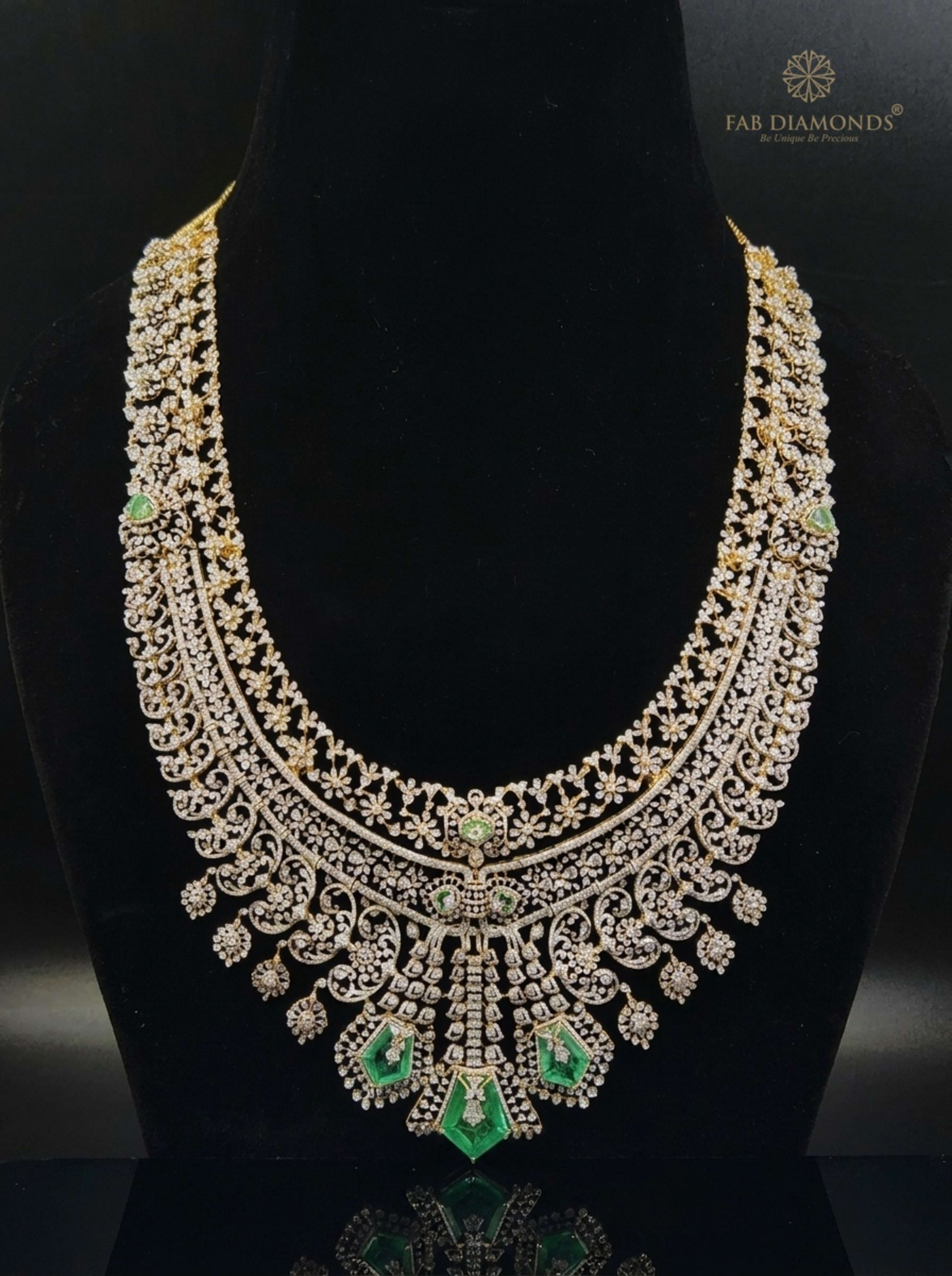 Three-Tier Diamond Lattice Haram with Triple Shield Emerald Drops on reflective plinth with gold FAB logo