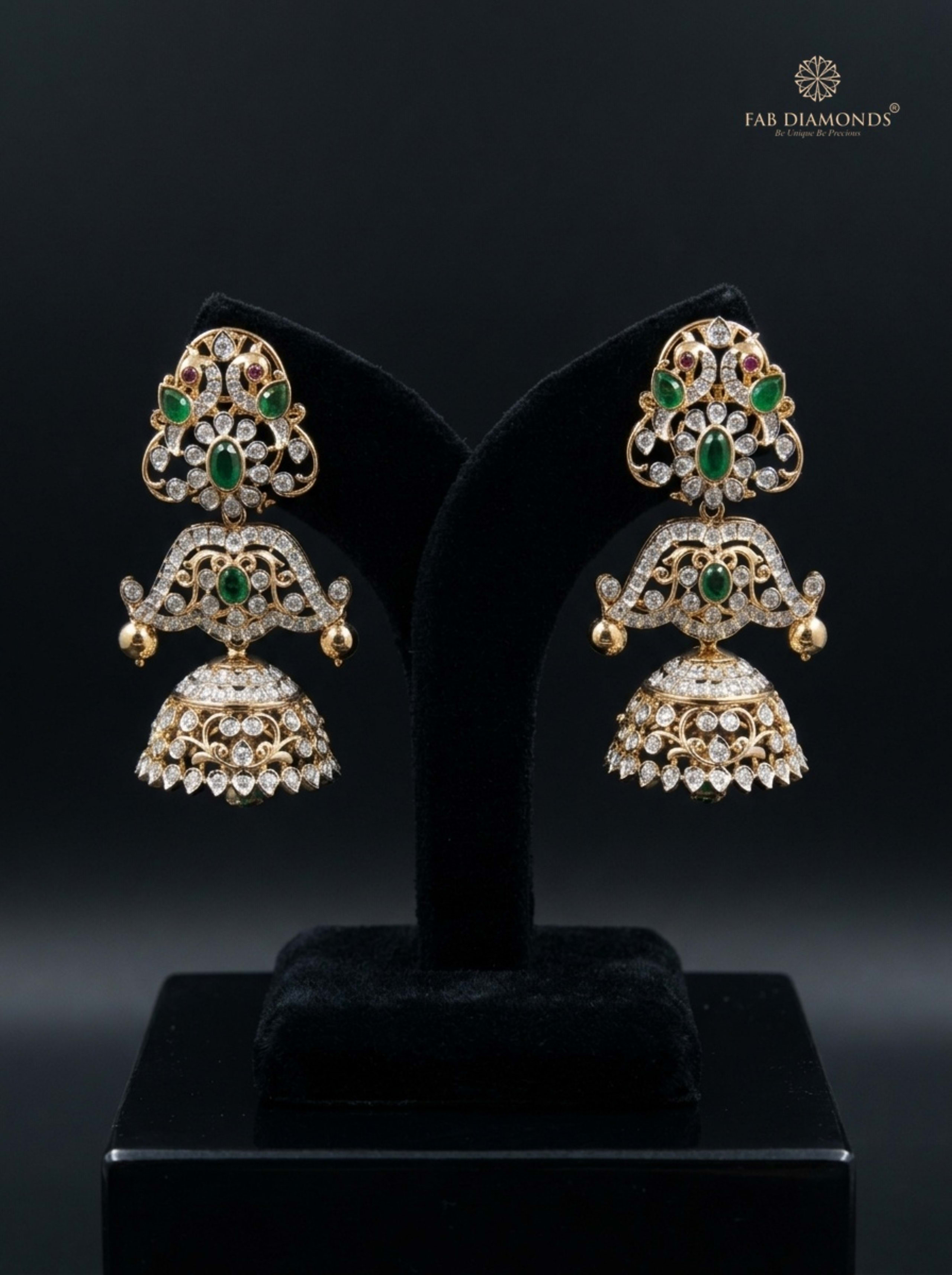 A pair of Ambika pagoda arch diamond jhumkas on dark slate rock blocks