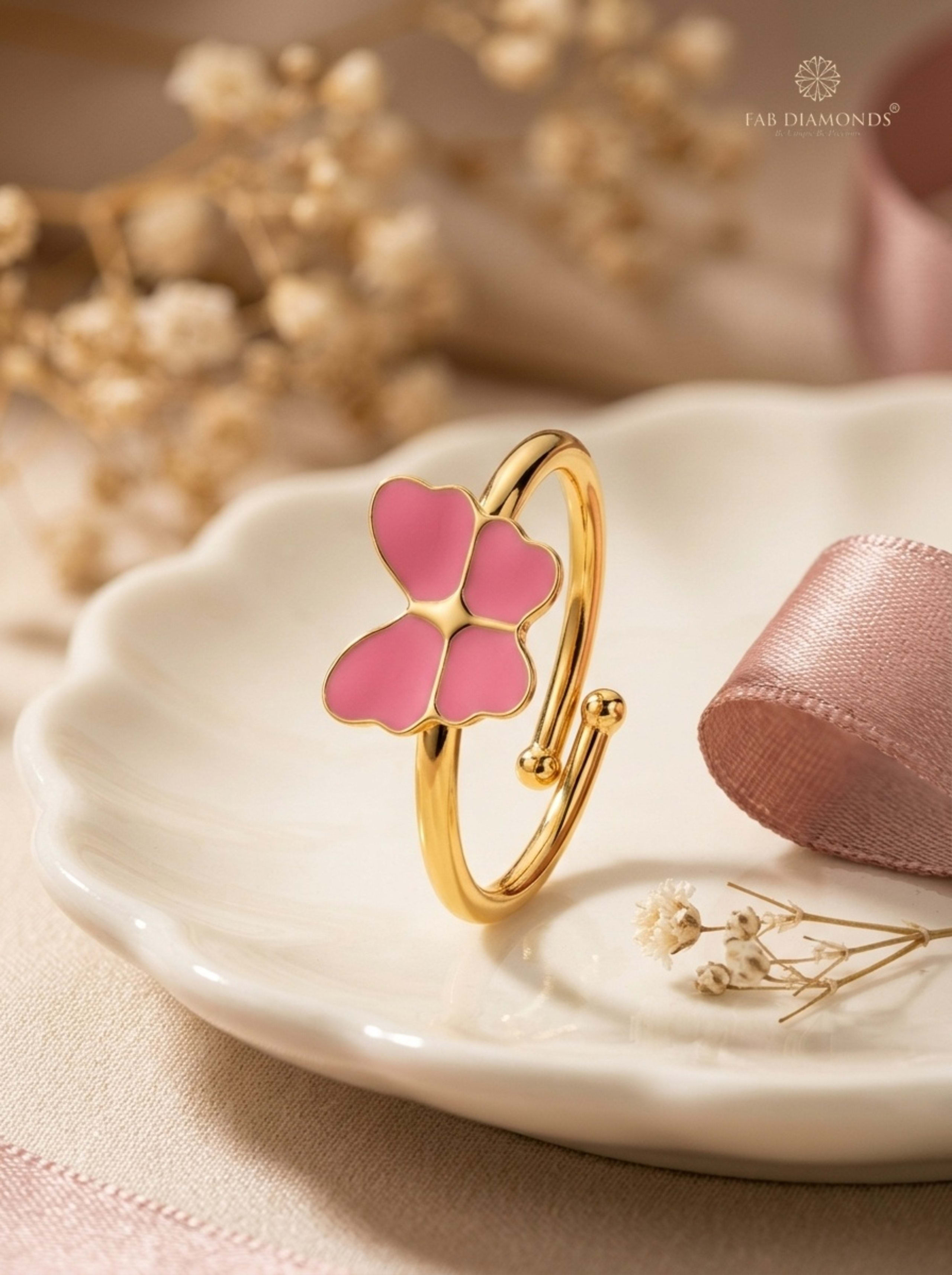 Titli Flutter Butterfly Enamel Baby Bypass Ring on scalloped porcelain dish