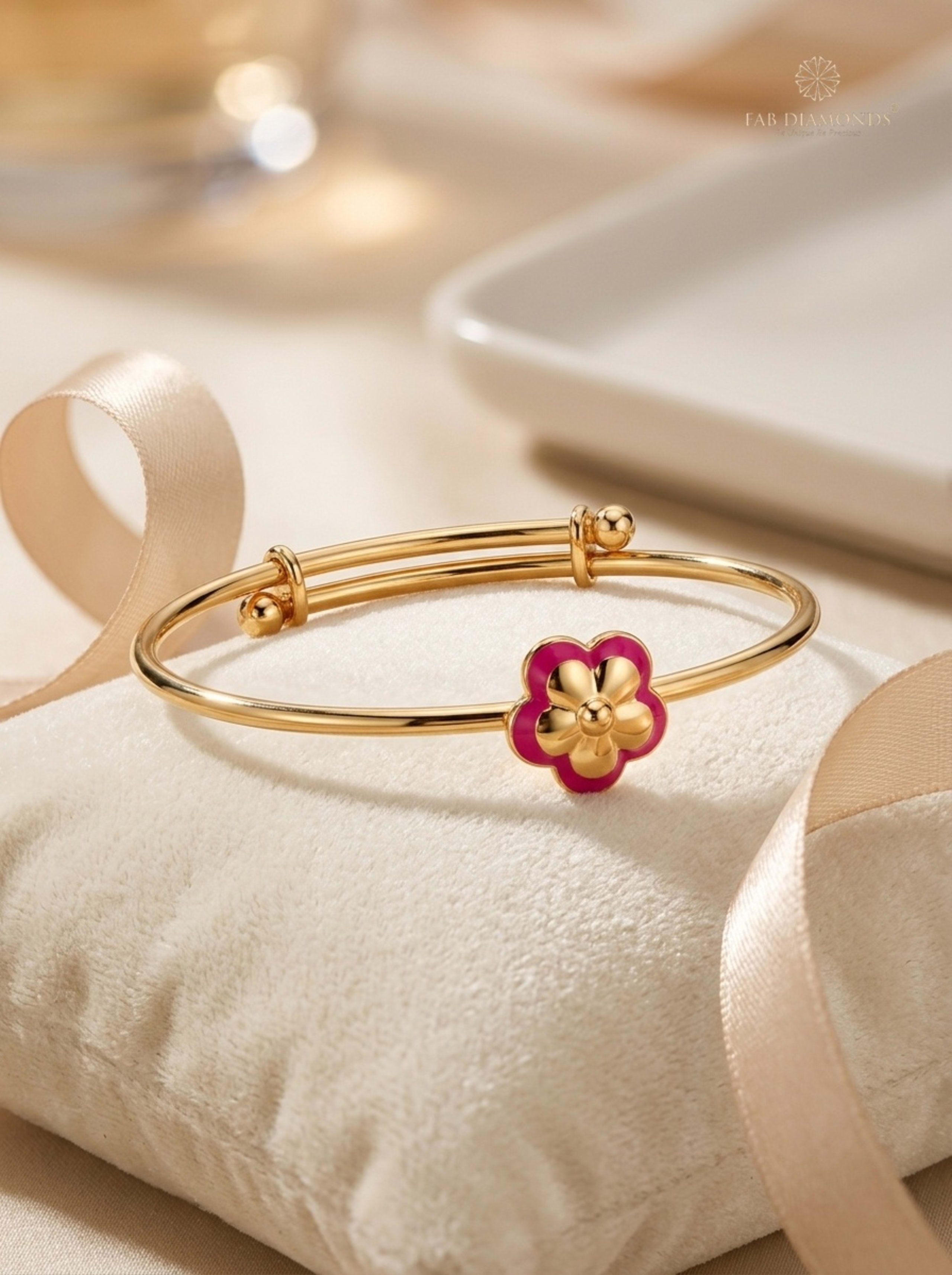 Devika Blossom Expandable Baby Kada Bangle on ivory velvet cushion