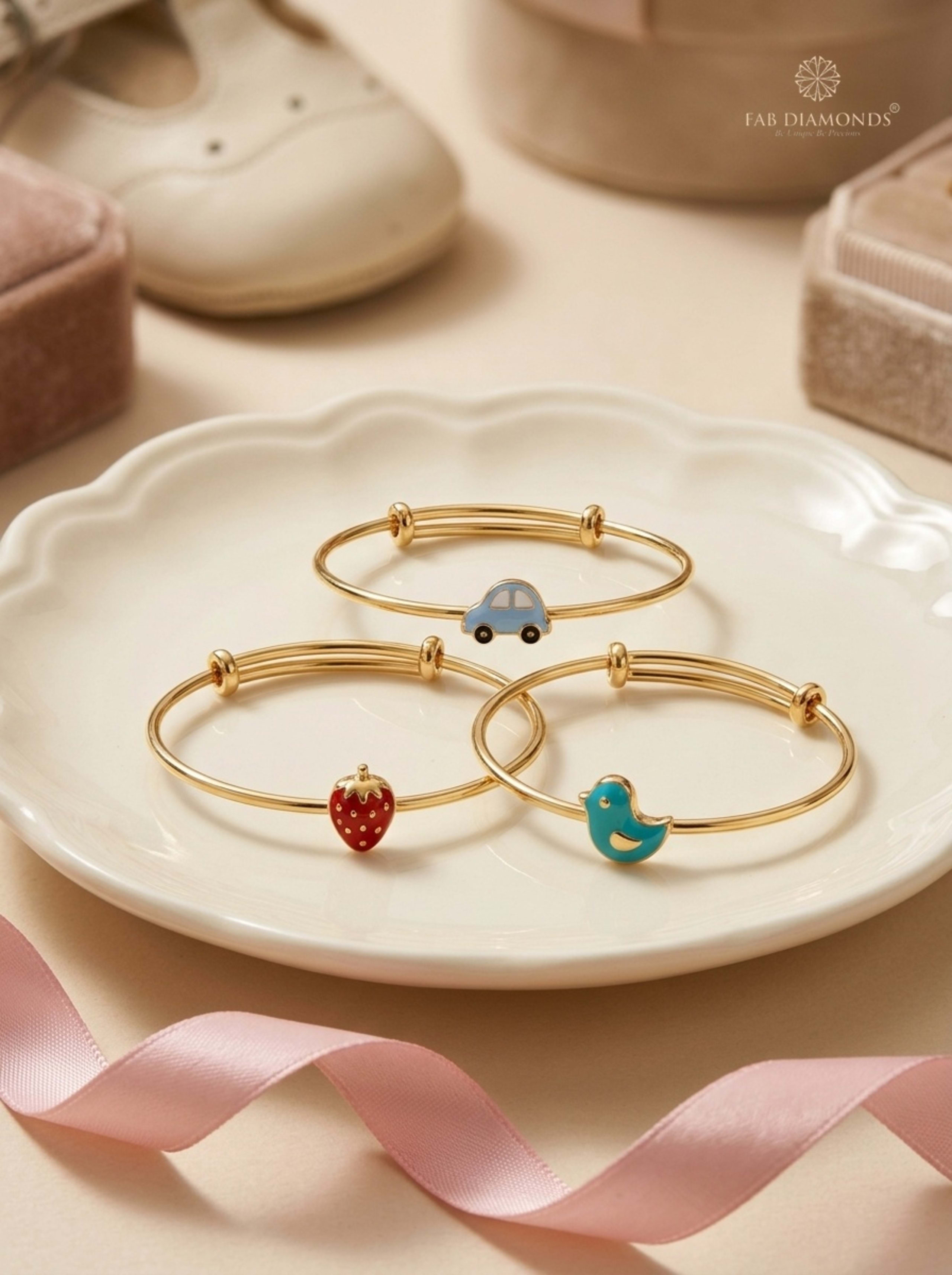 Little Charms Trio Expandable Baby Kada Set on scalloped porcelain tray