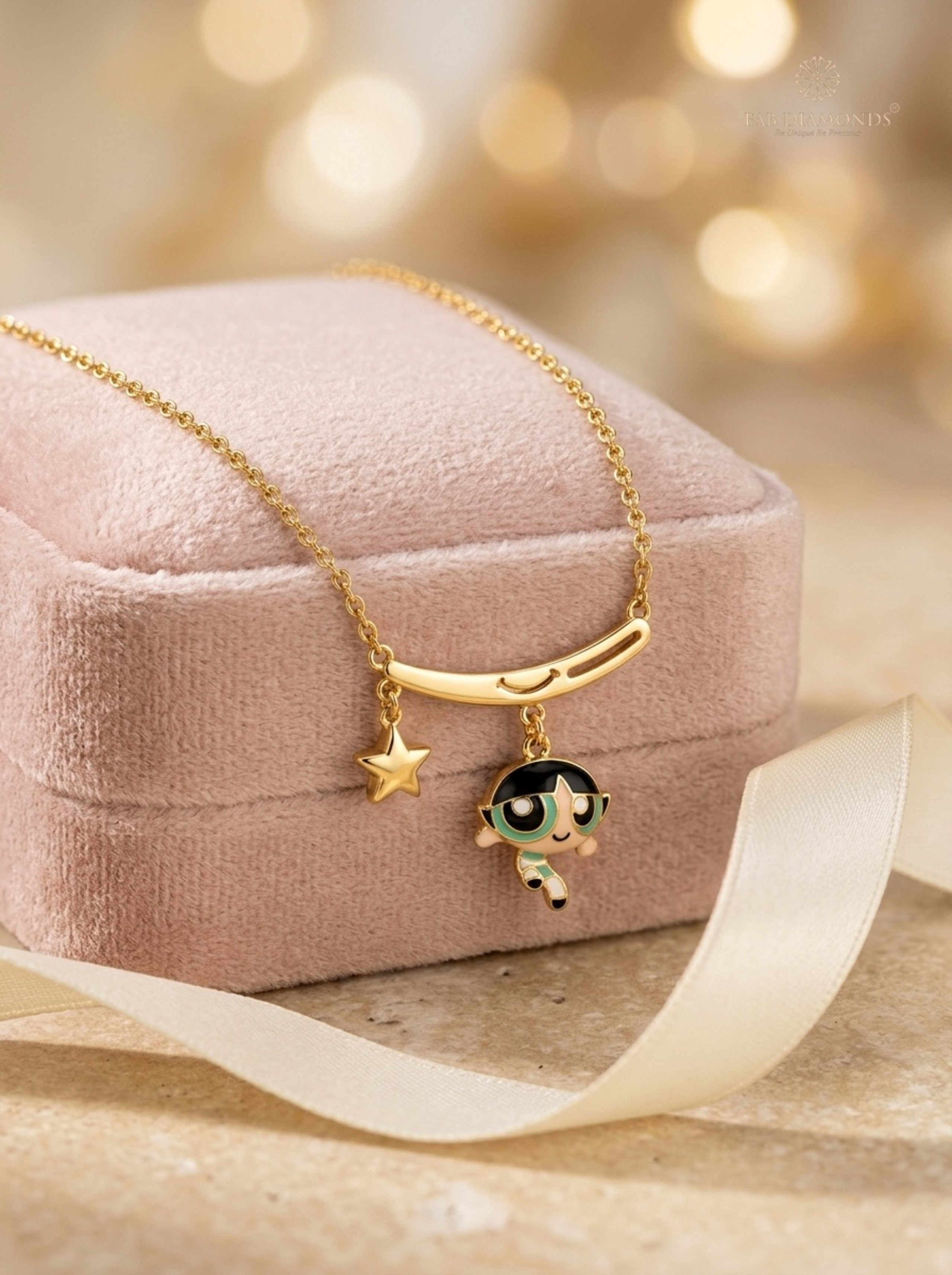 Buttercup Smiling Bar & Star Enamel Baby Necklace on blush velvet jewel box