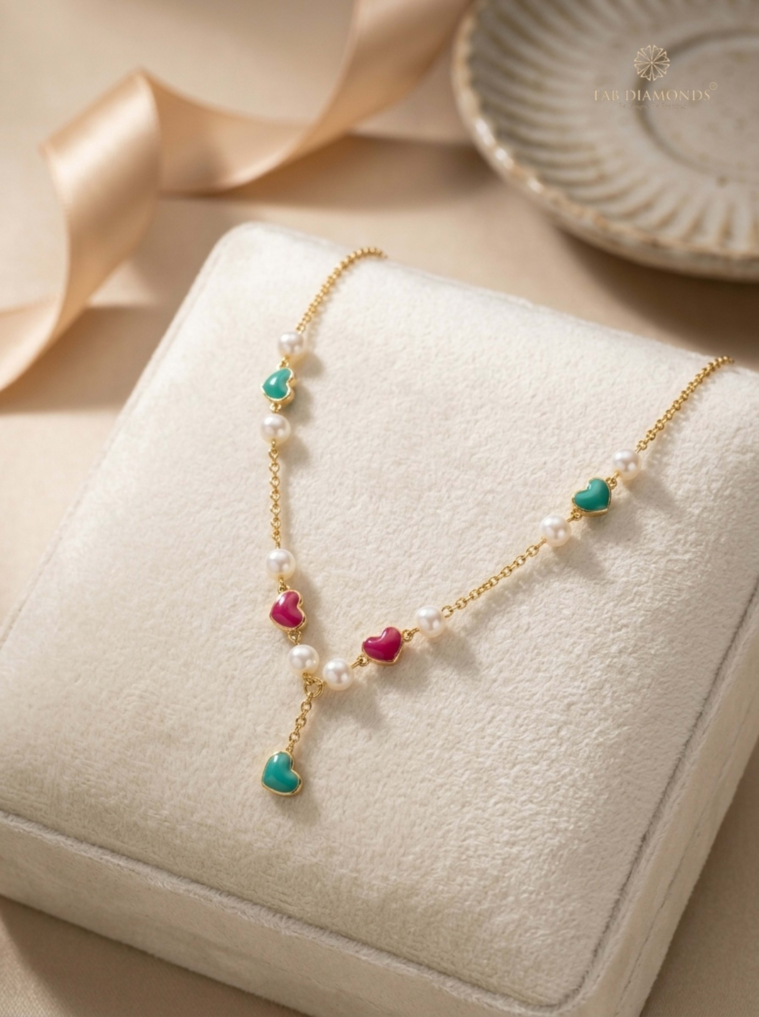 Motia Seed Pearl & Enamel Hearts Baby Y-Necklace on ivory presentation cushion