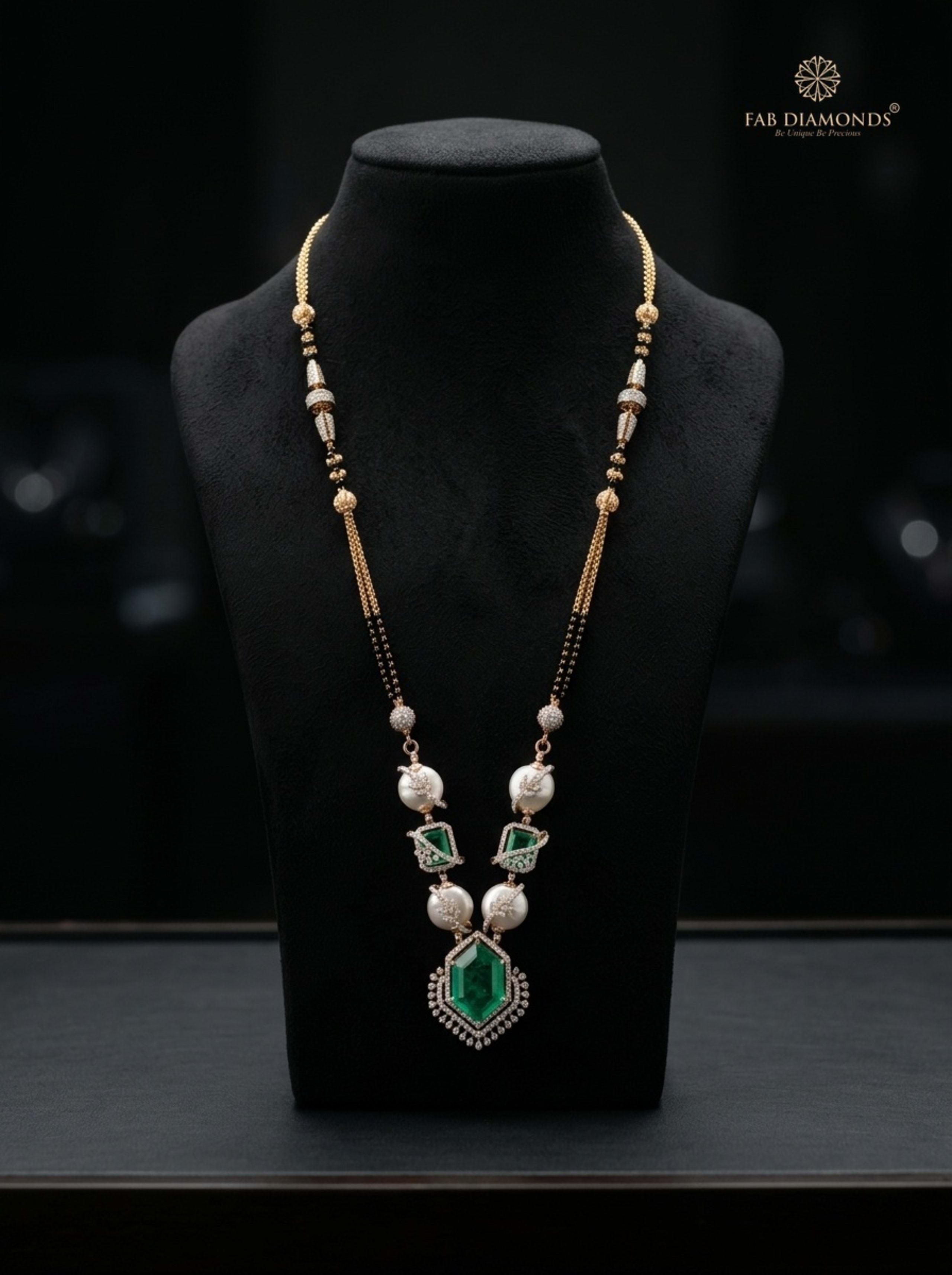 Padmavathi imperial baroque pearl and emerald medallion mangalsutra on white Carrara marble