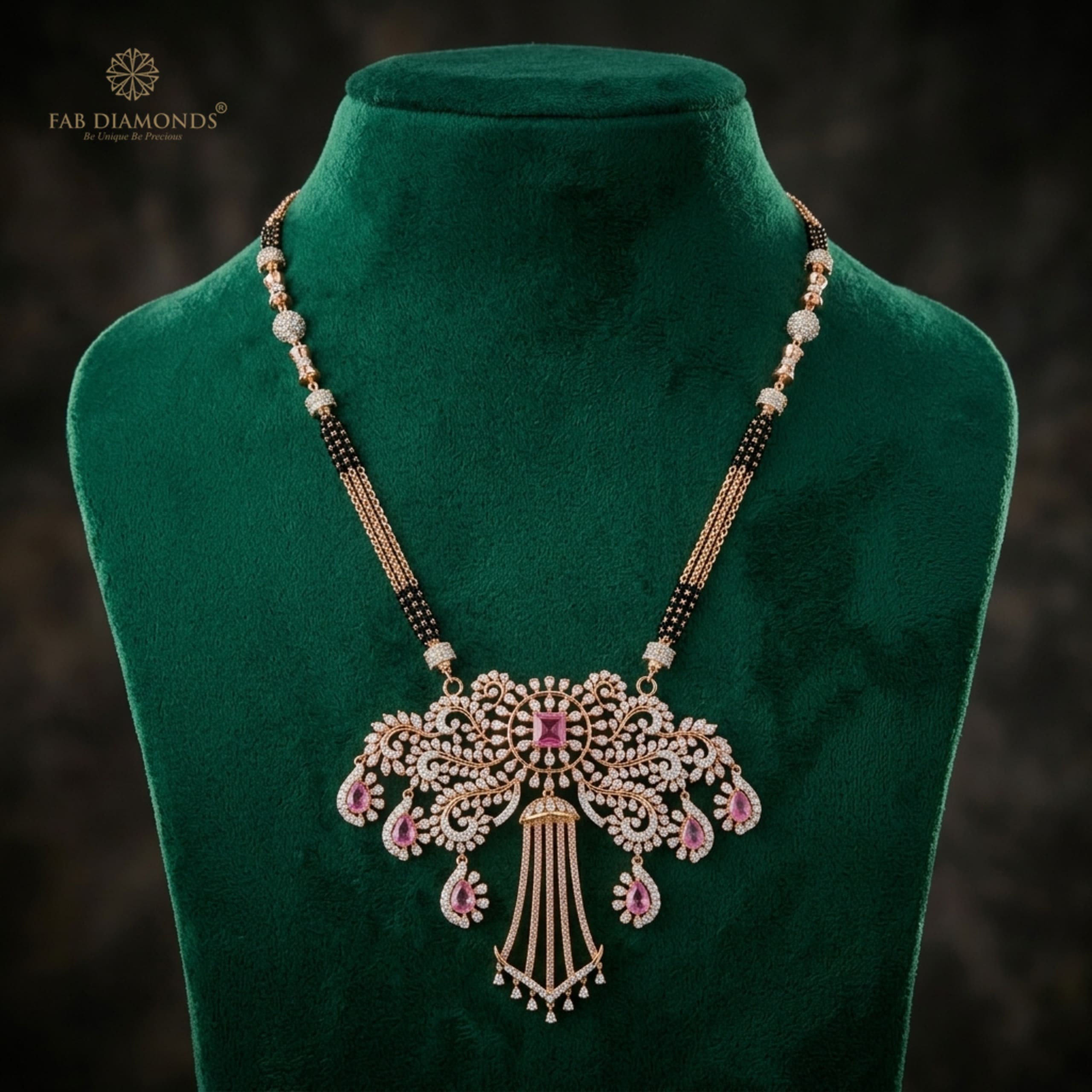 Mayuri foliate butterfly diamond and pink tourmaline mangalsutra on emerald velvet bust