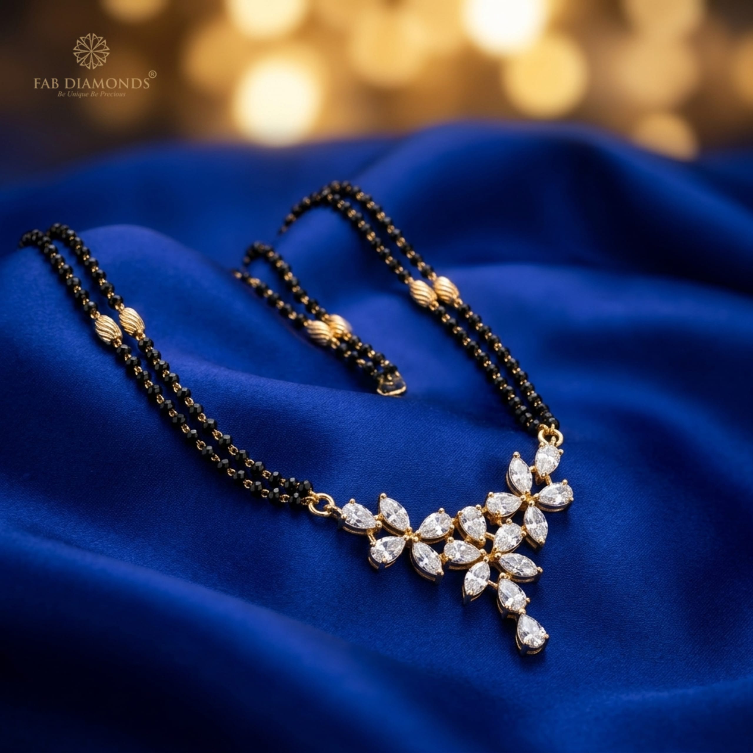 Tarini marquise and pear diamond cluster chevron mangalsutra on draped royal blue silk