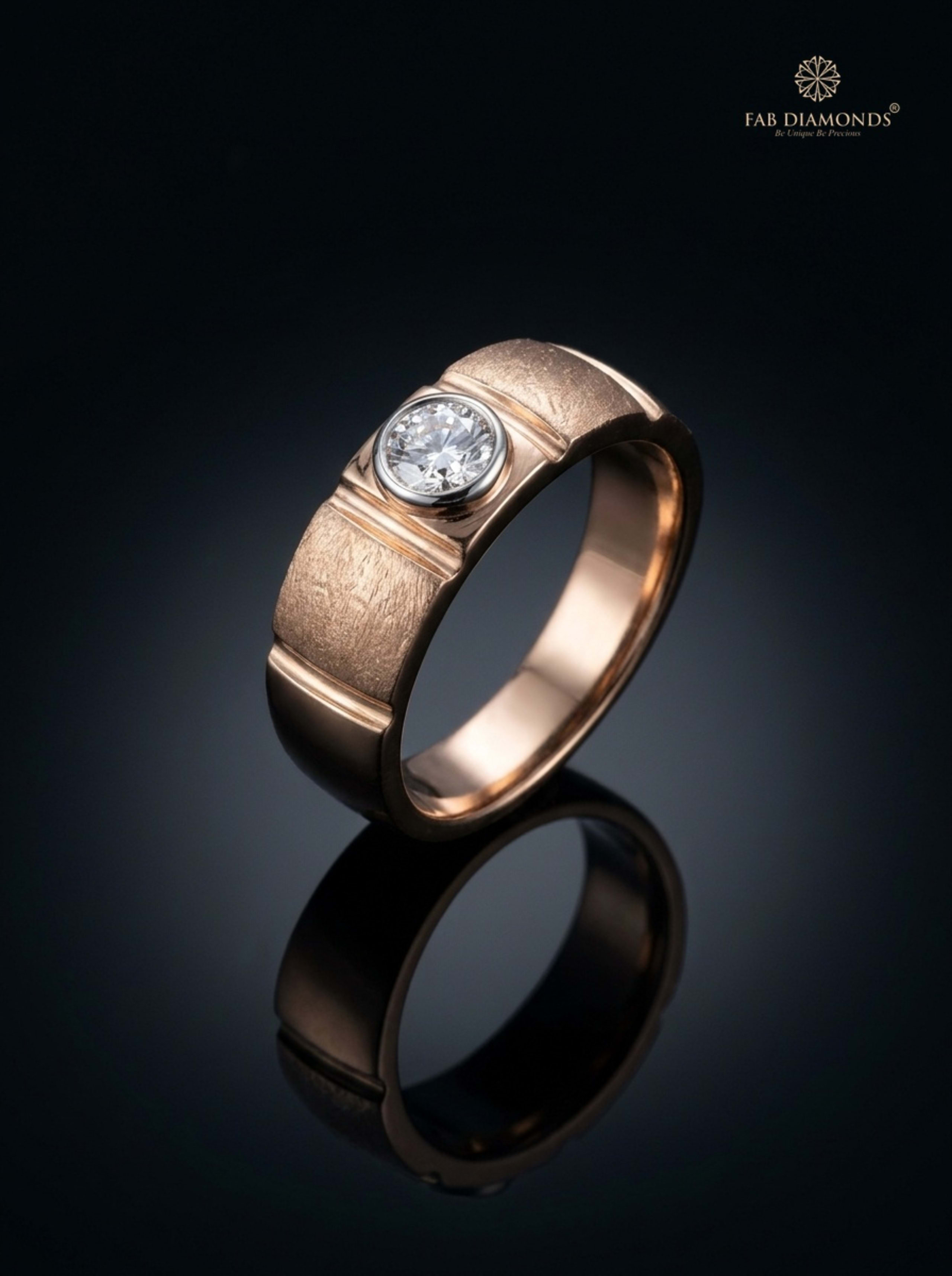 Adhira Solitaire Bezel Men’s Ring in 18KT gold on atelier stand