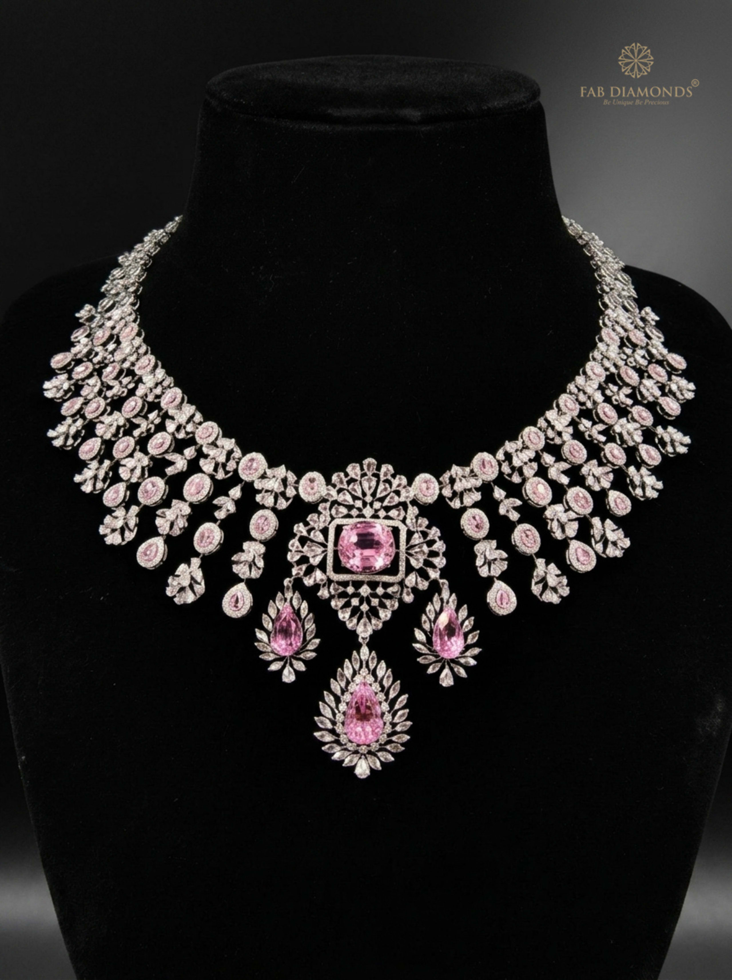 Lavanya kunzite pink gemstone and diamond gala choker on matte black velvet bust with studio rim lighting