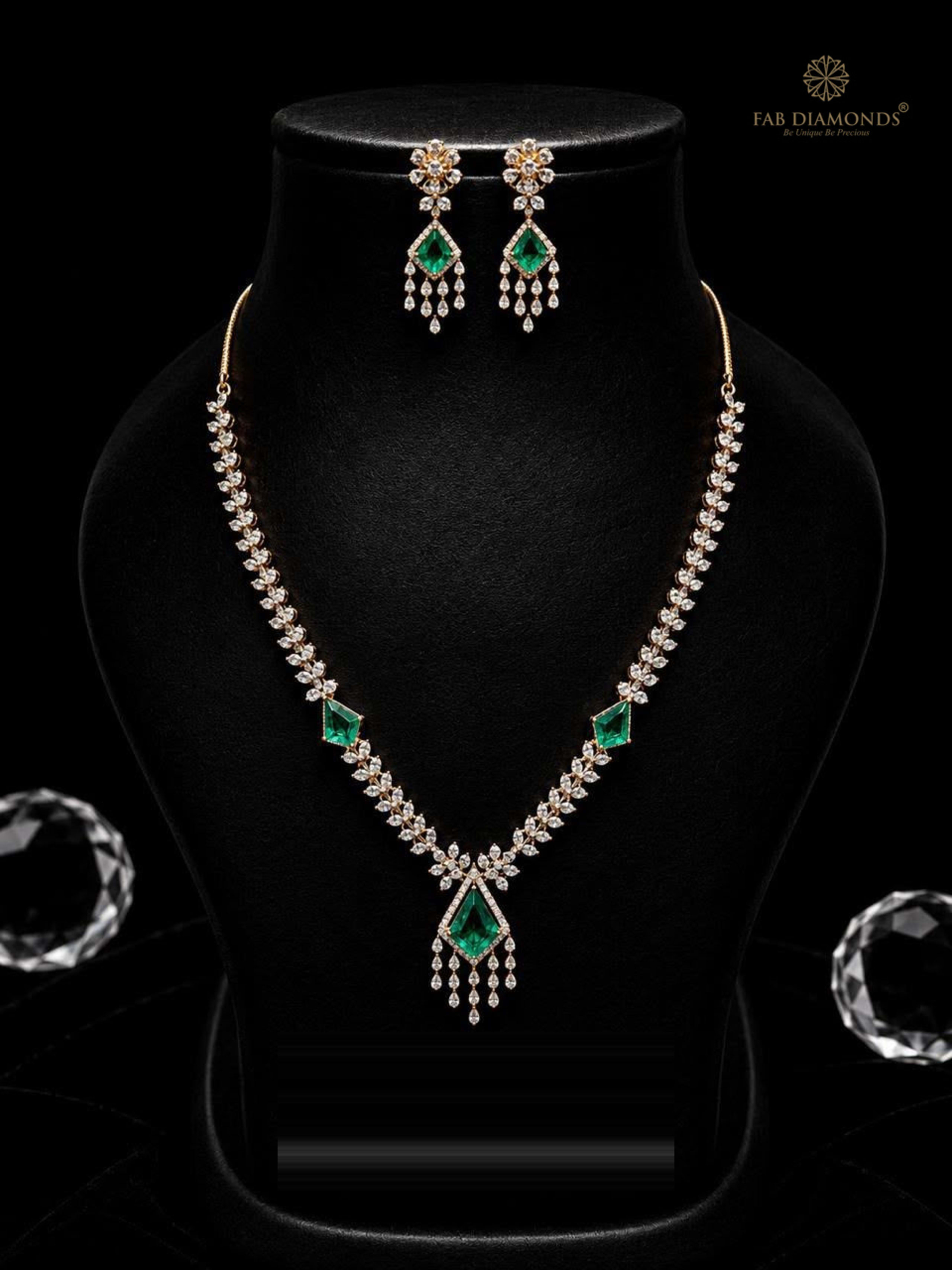 Nayana geometric kite emerald diamond V-contour suite on sleek black velvet bust with crystal props
