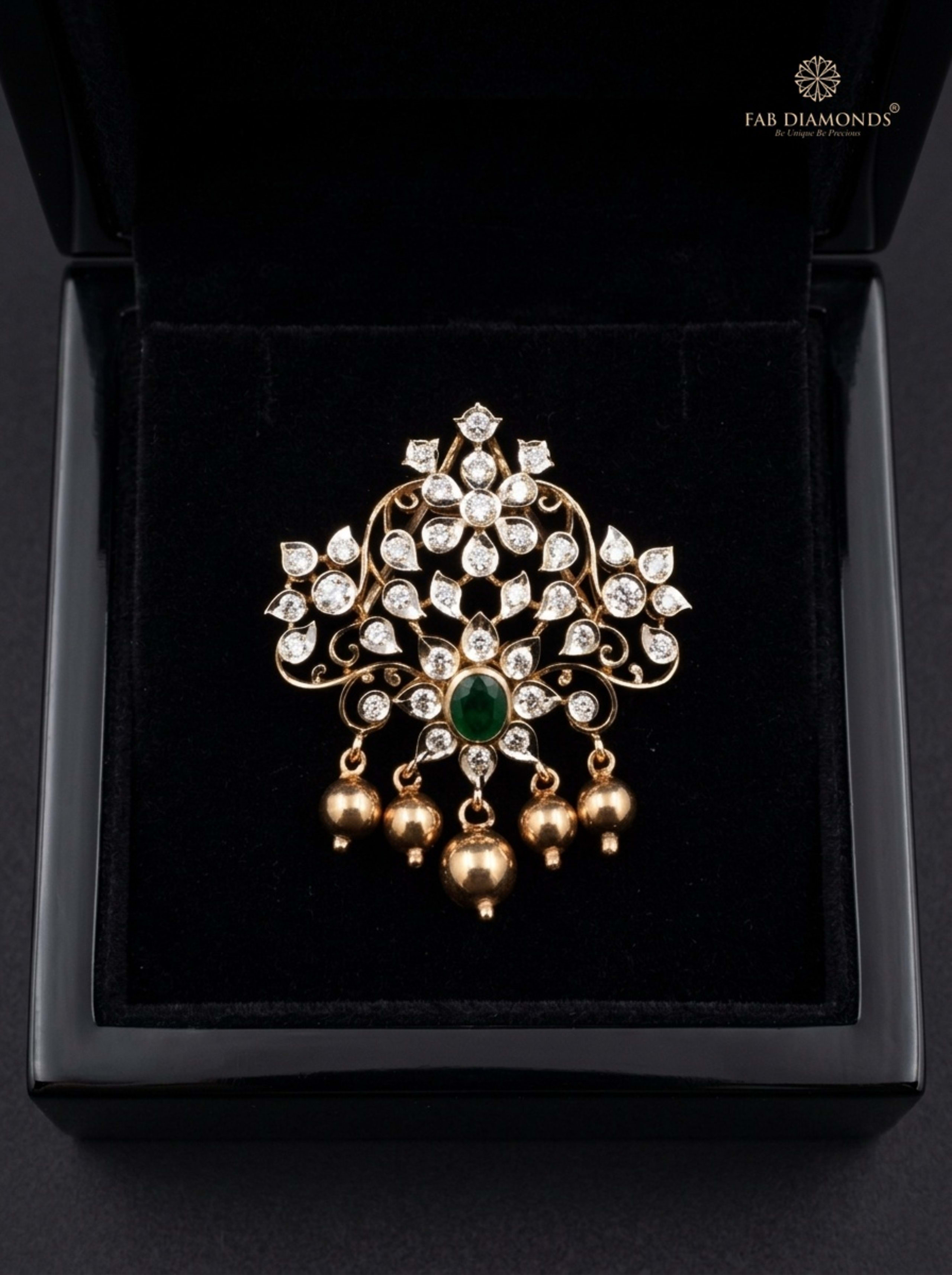 Kavya floral emerald, ruby and diamond cluster pendant resting on plush black velvet in glossy black display box