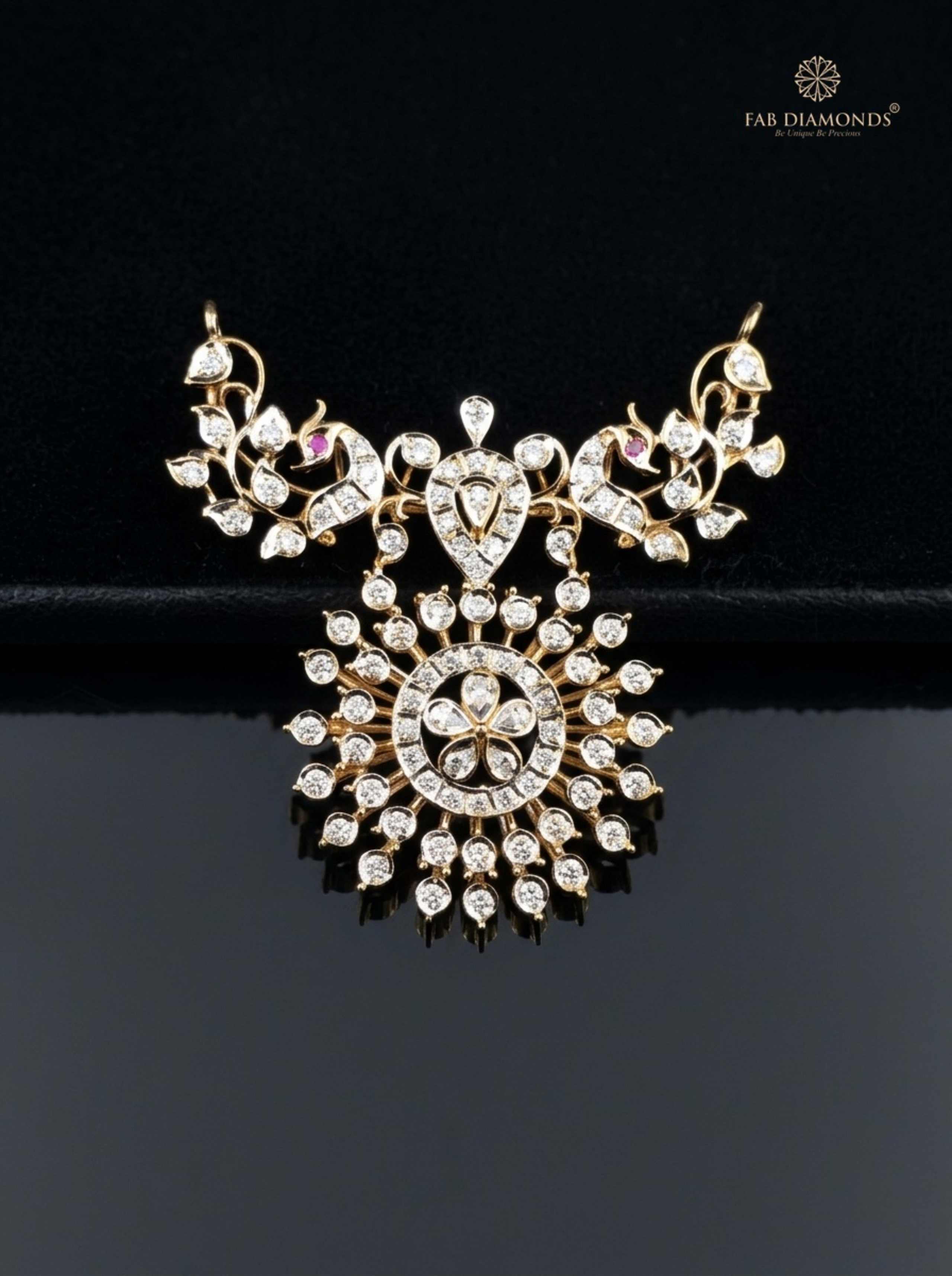 Meera ruby and diamond openwork filigree crest pendant resting on ivory scalloped linen plate