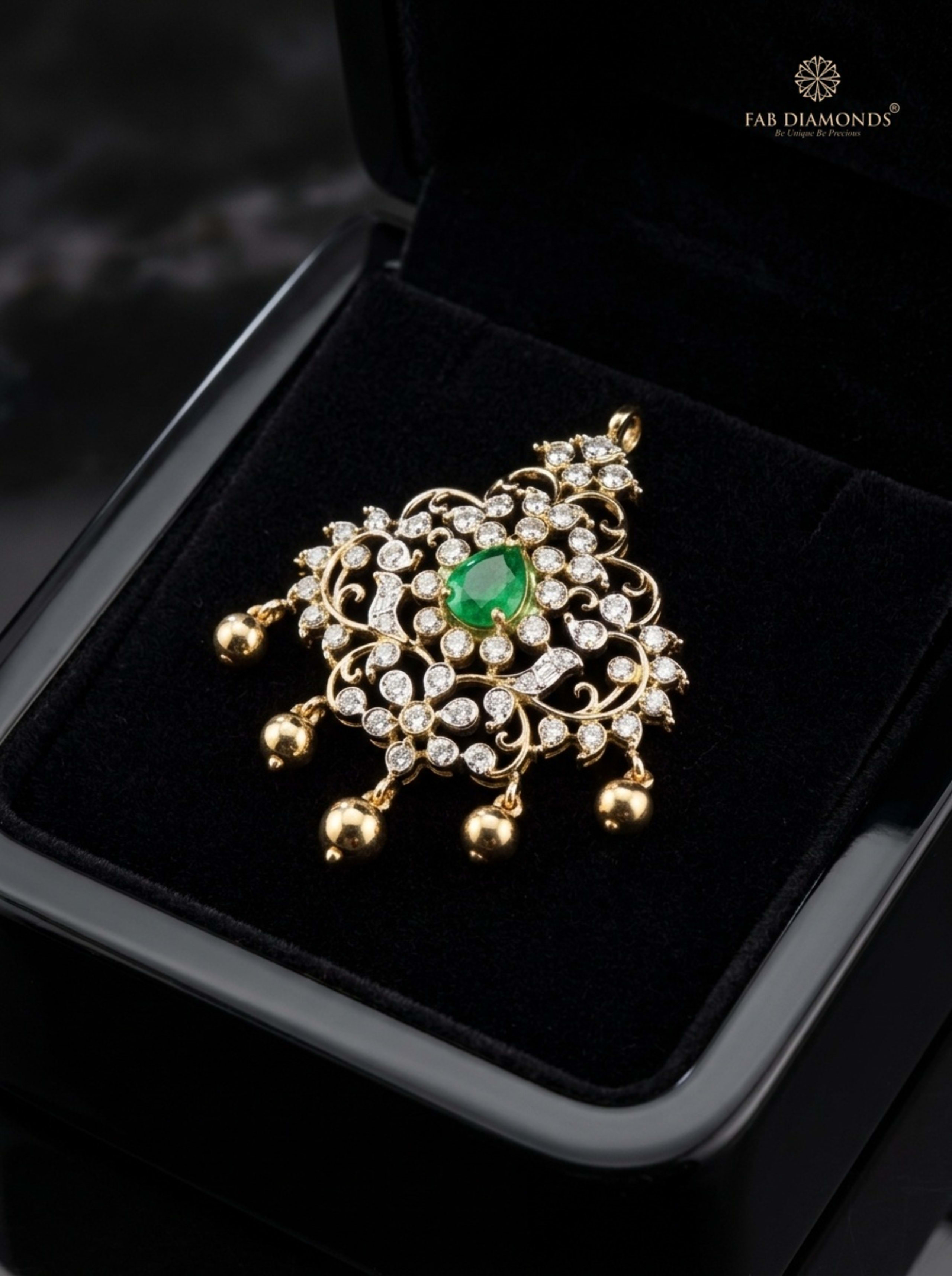 Ananya floral bloom emerald and ruby cluster pendant resting on plush black velvet in glossy black display box