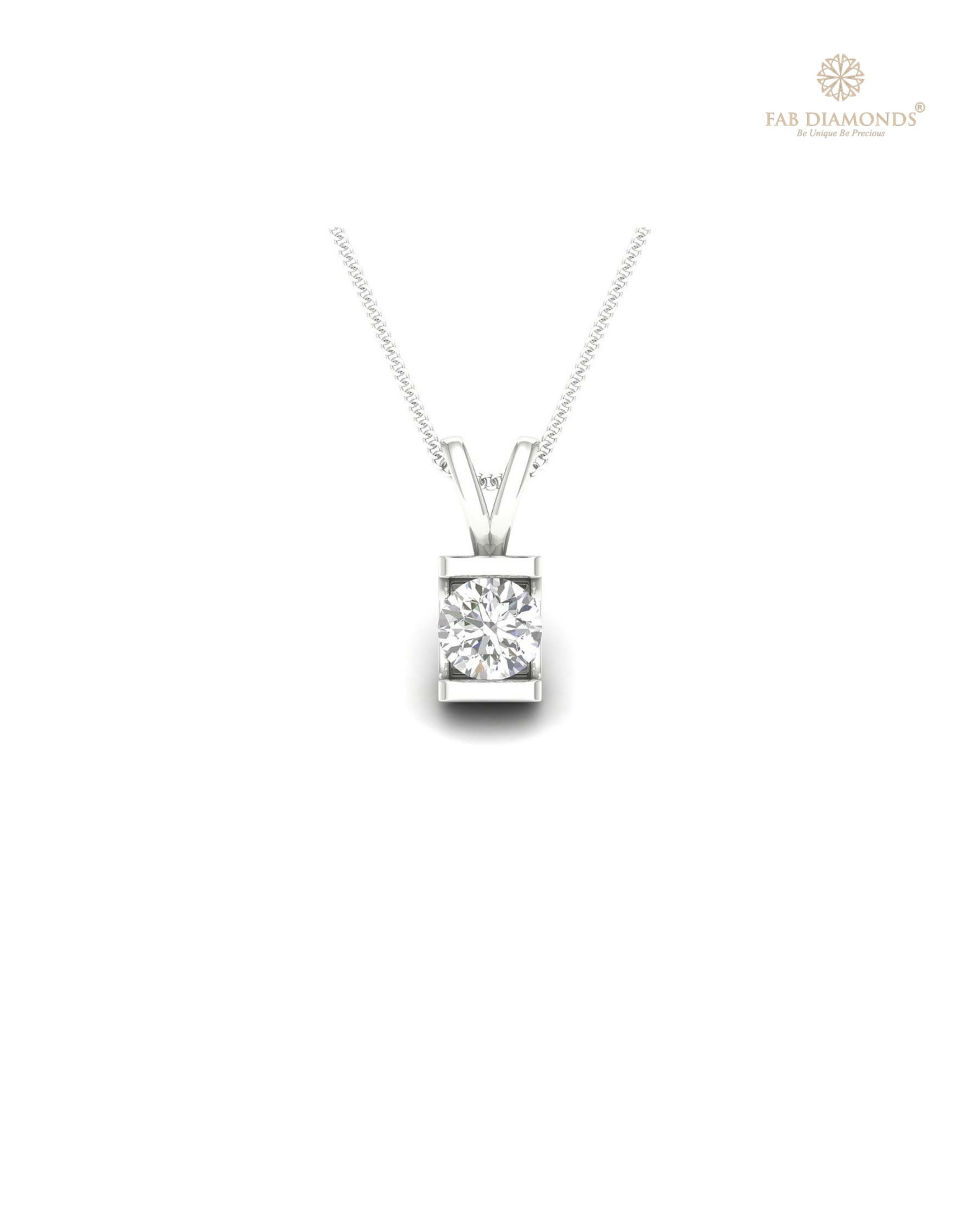 The PS00094 Floating Solitaire Diamond Pendant (0.20 Cts) on white atelier plate with FAB hallmark