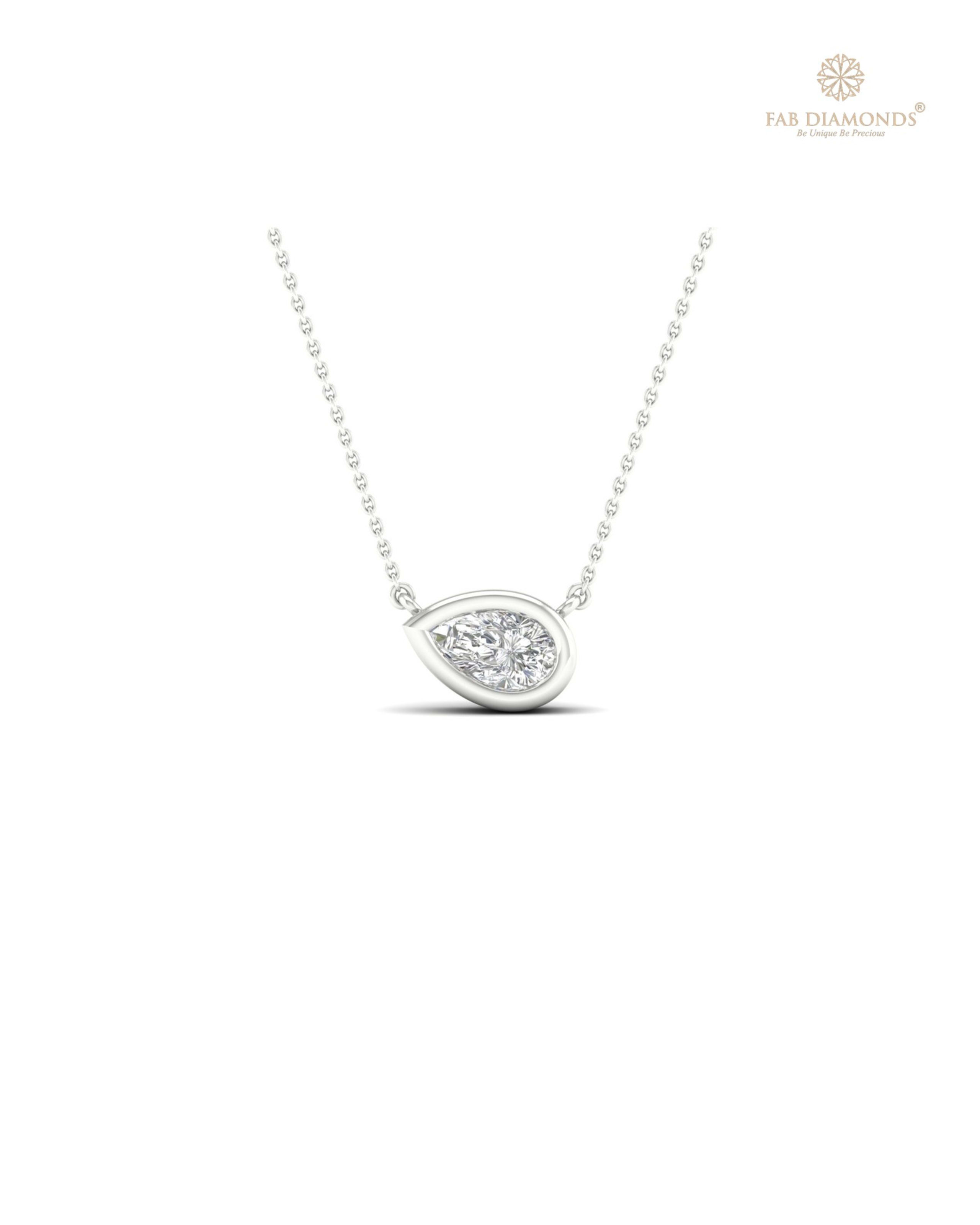 The PS00317 Floating Solitaire Diamond Pendant (0.10 Cts) on white atelier plate with FAB hallmark