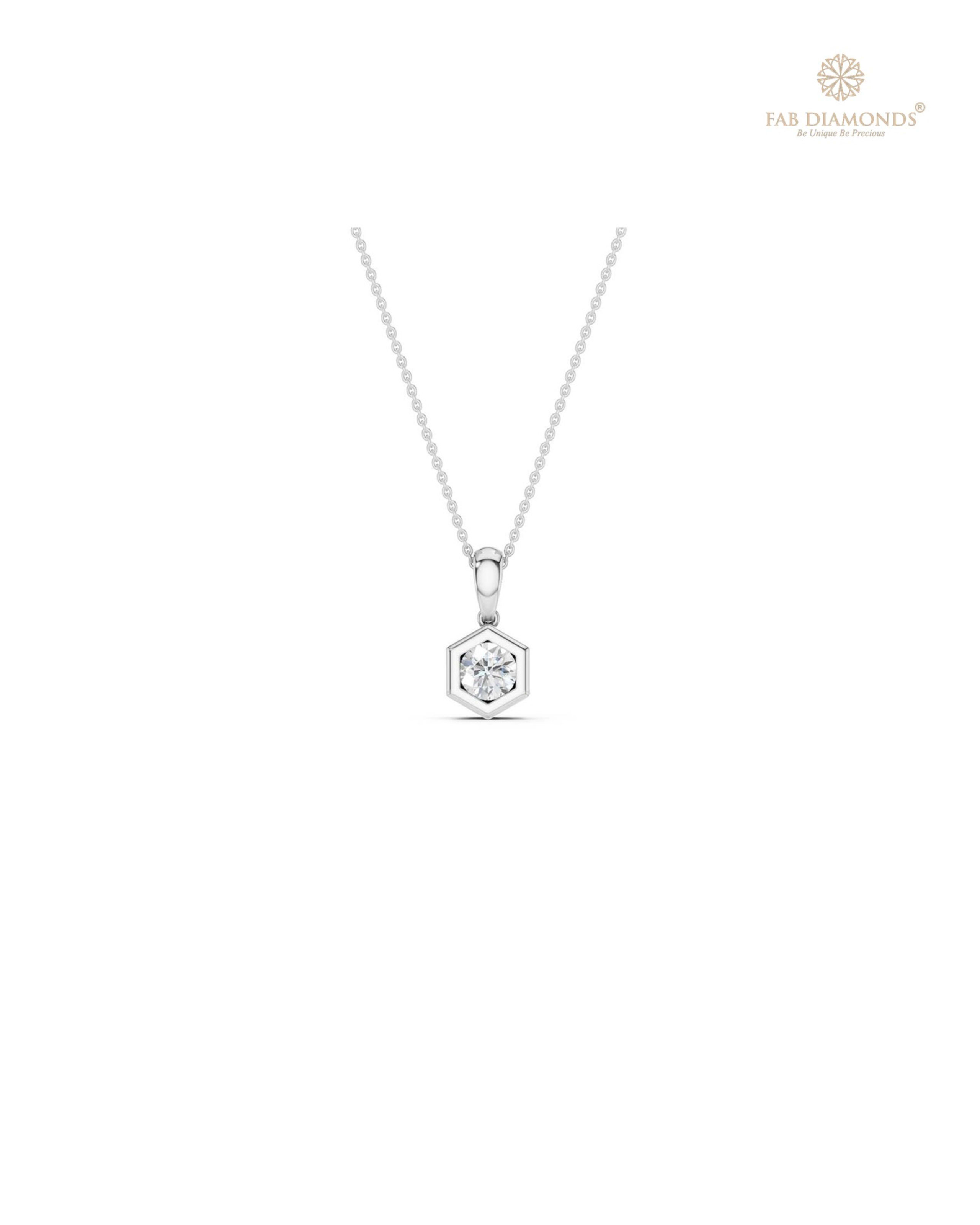 The PS05788 Floating Solitaire Diamond Pendant (0.25 Cts) on white atelier plate with FAB hallmark