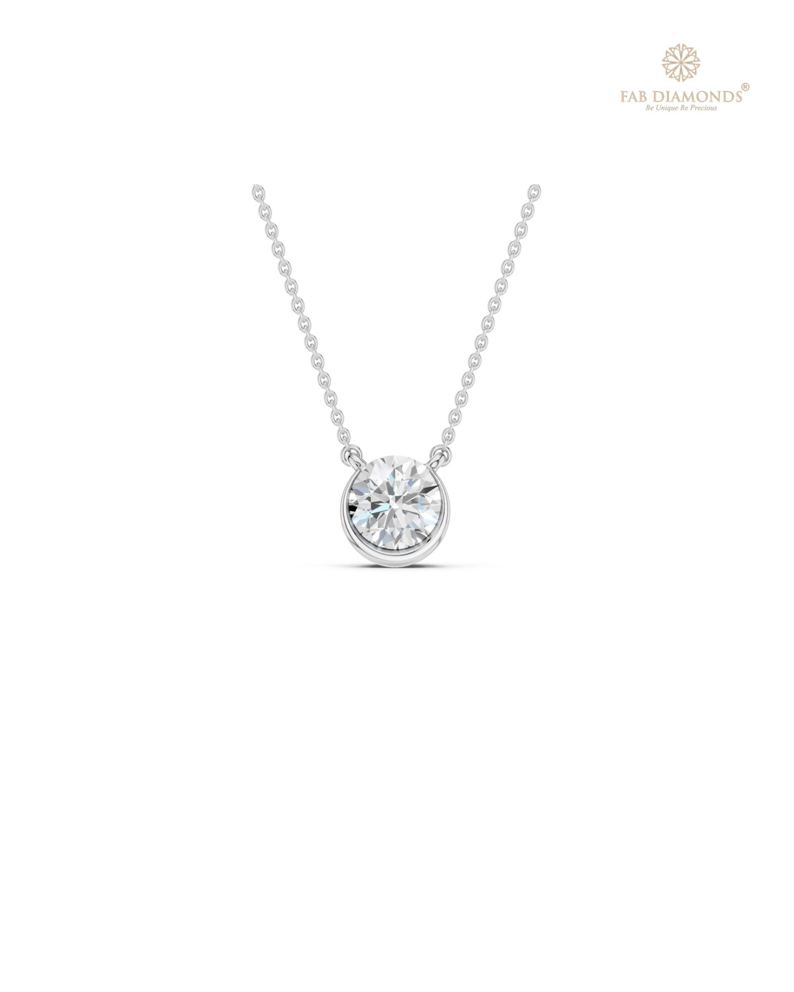 The PS06476 Architectural Solitaire Diamond Pendant (0.50 Cts) on white atelier plate with FAB hallmark
