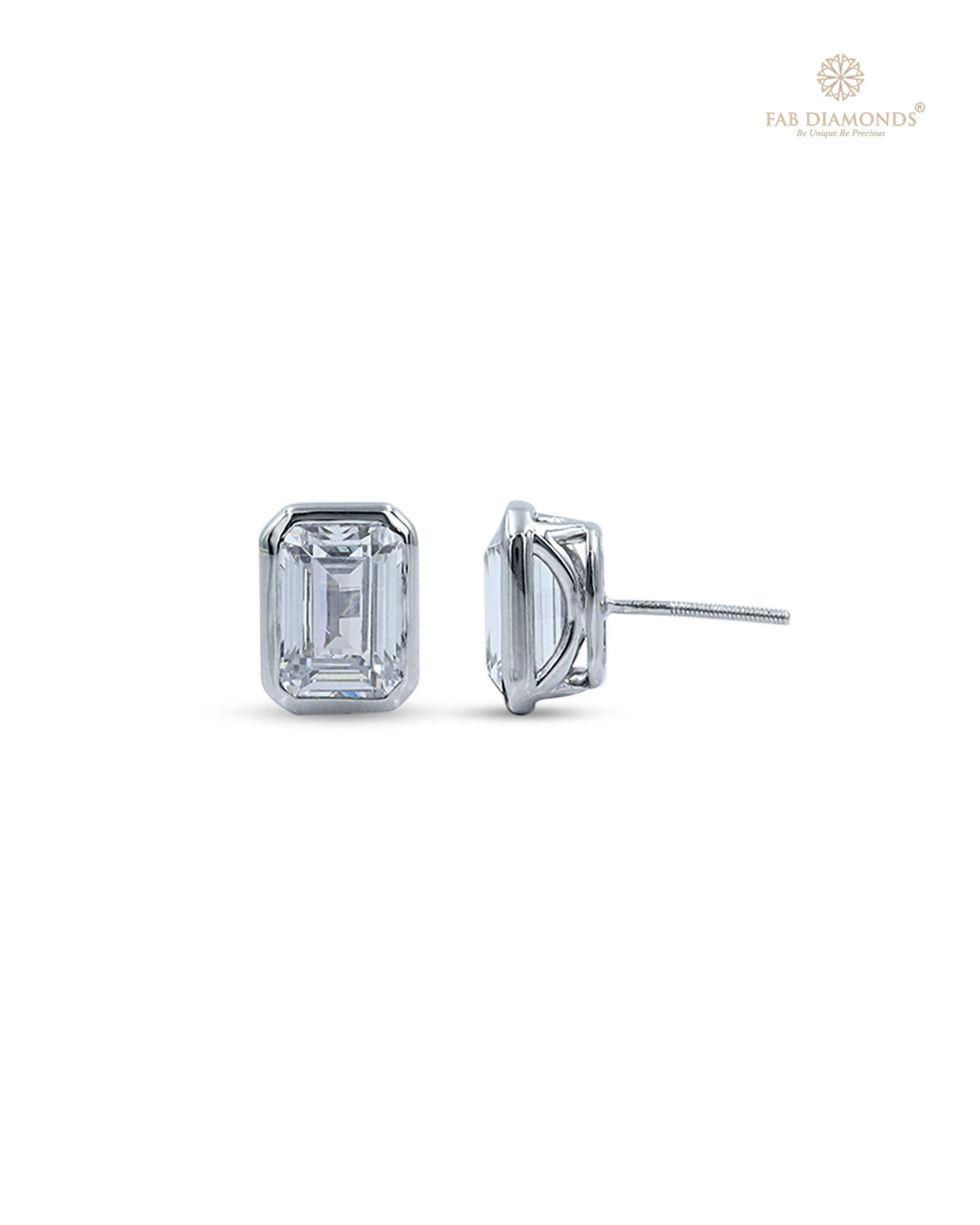 The EA02EM200 Emerald-Cut Diamond Studs (4.00 Cts) on white atelier plate with FAB hallmark
