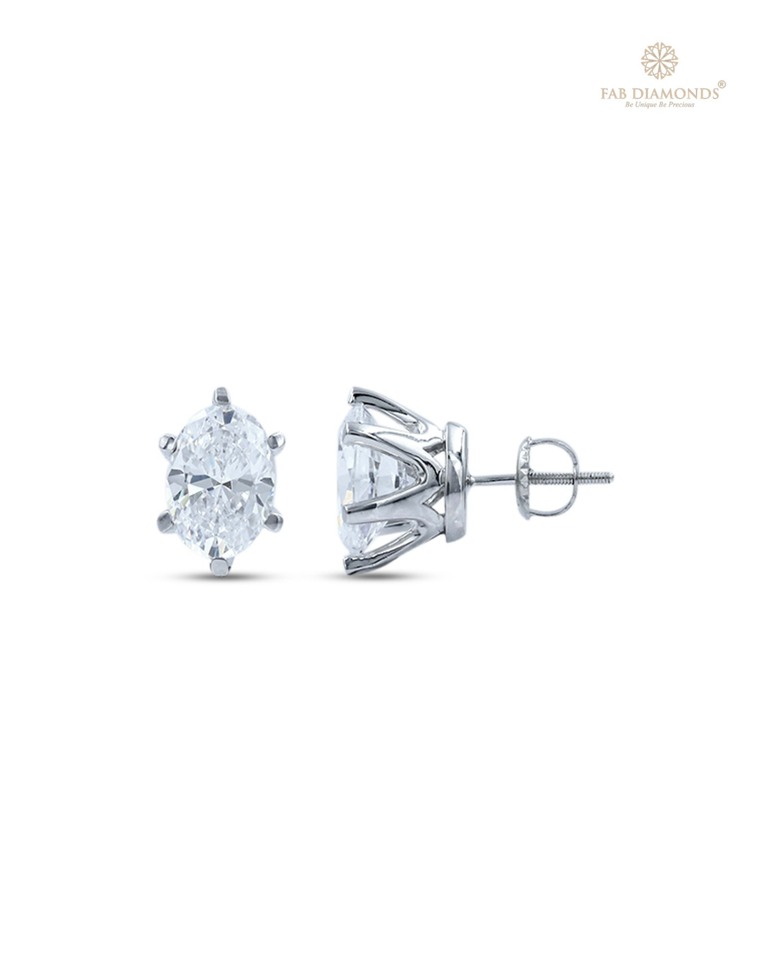 The EA07OV200 Oval-Cut Diamond Studs (4.00 Cts) on white atelier plate with FAB hallmark