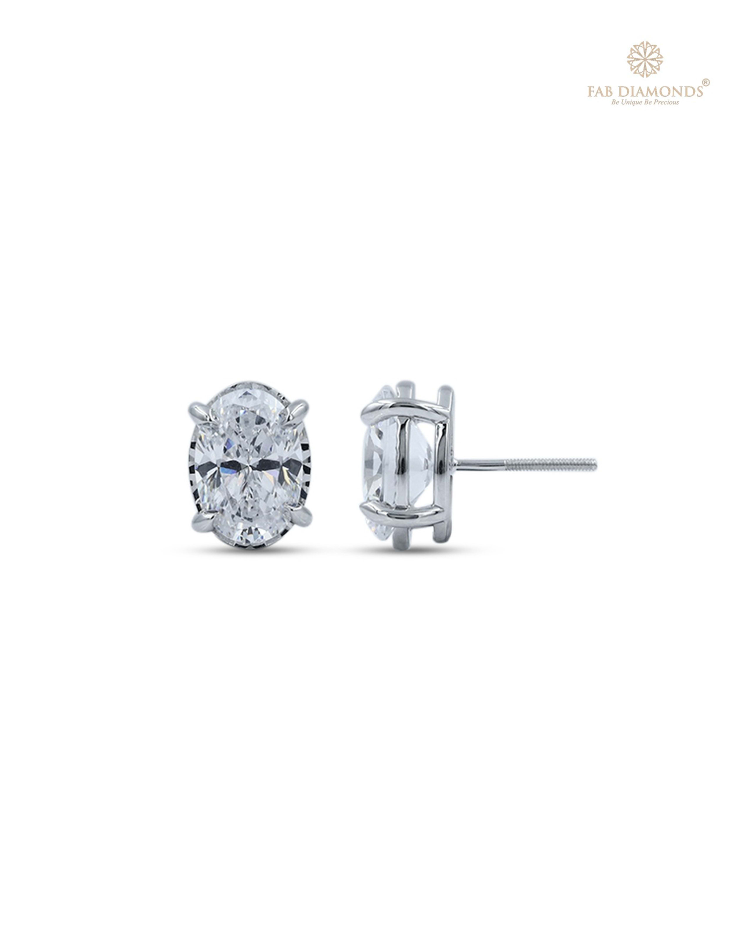 The EA66OV200 Oval-Cut Diamond Studs (4.00 Cts) on white atelier plate with FAB hallmark