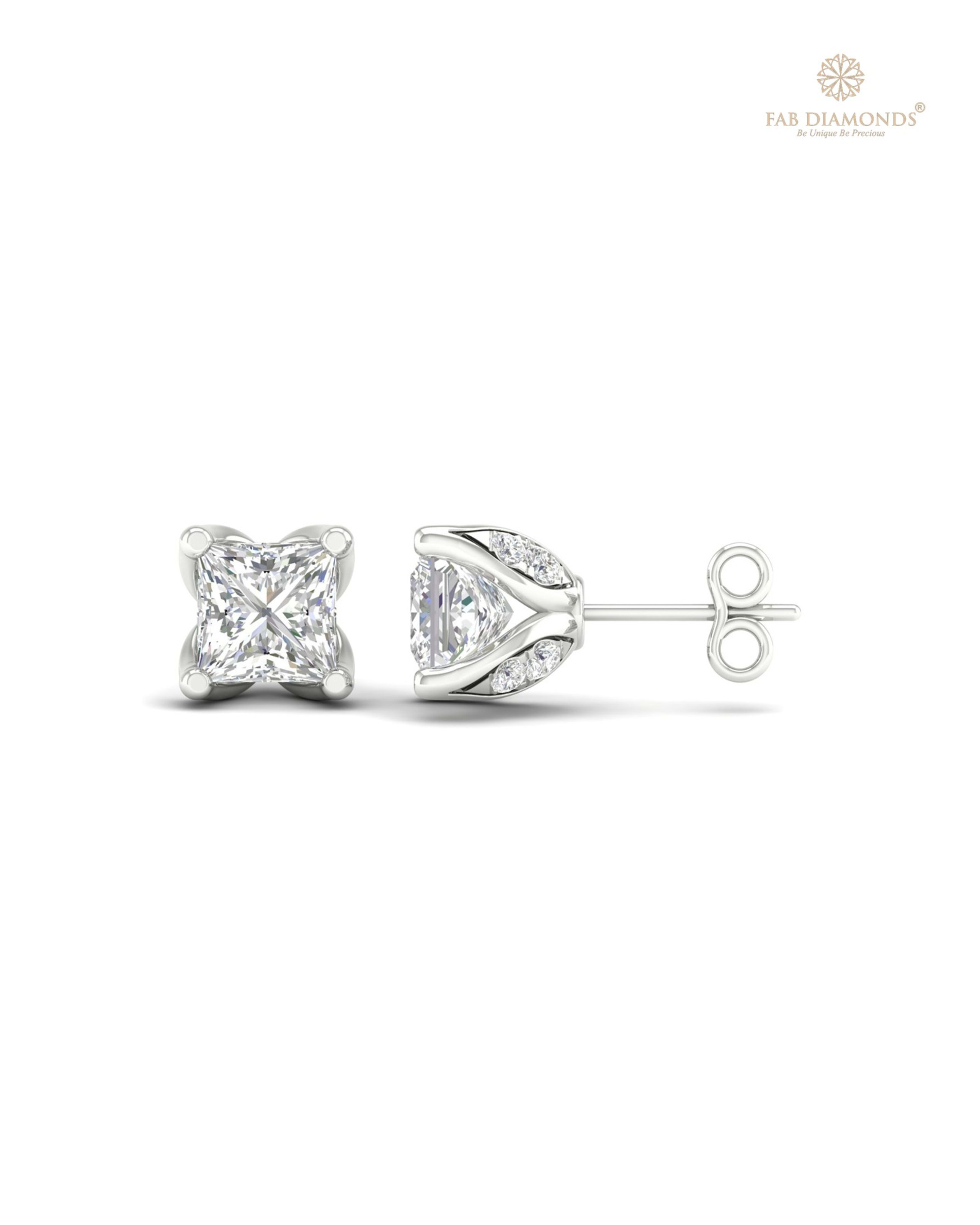 The ES00528 Diamond Halo Diamond Studs (1.15 Cts) on white atelier plate with FAB hallmark