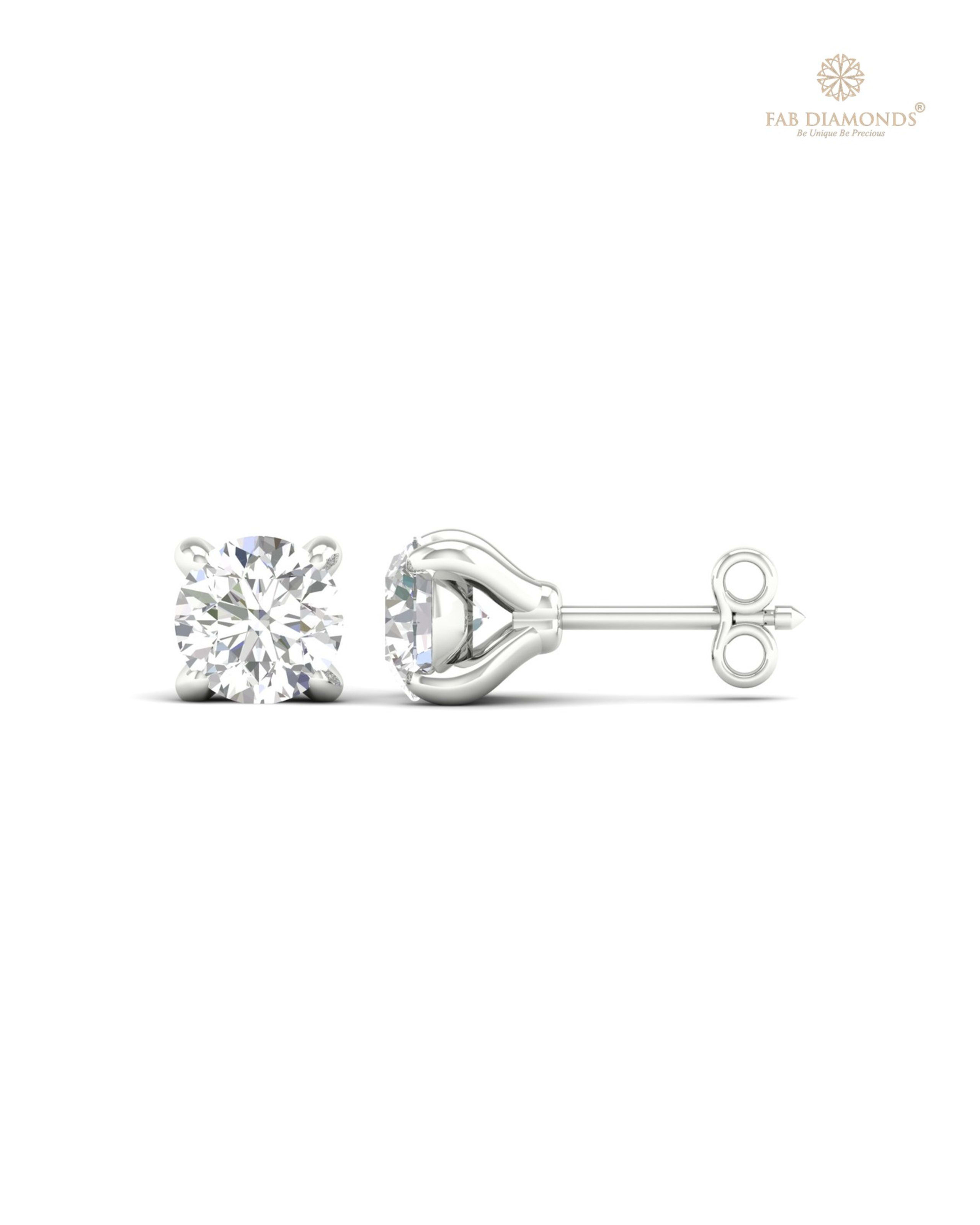 The ES00596 Classic Solitaire Diamond Studs (0.40 Cts) on white atelier plate with FAB hallmark