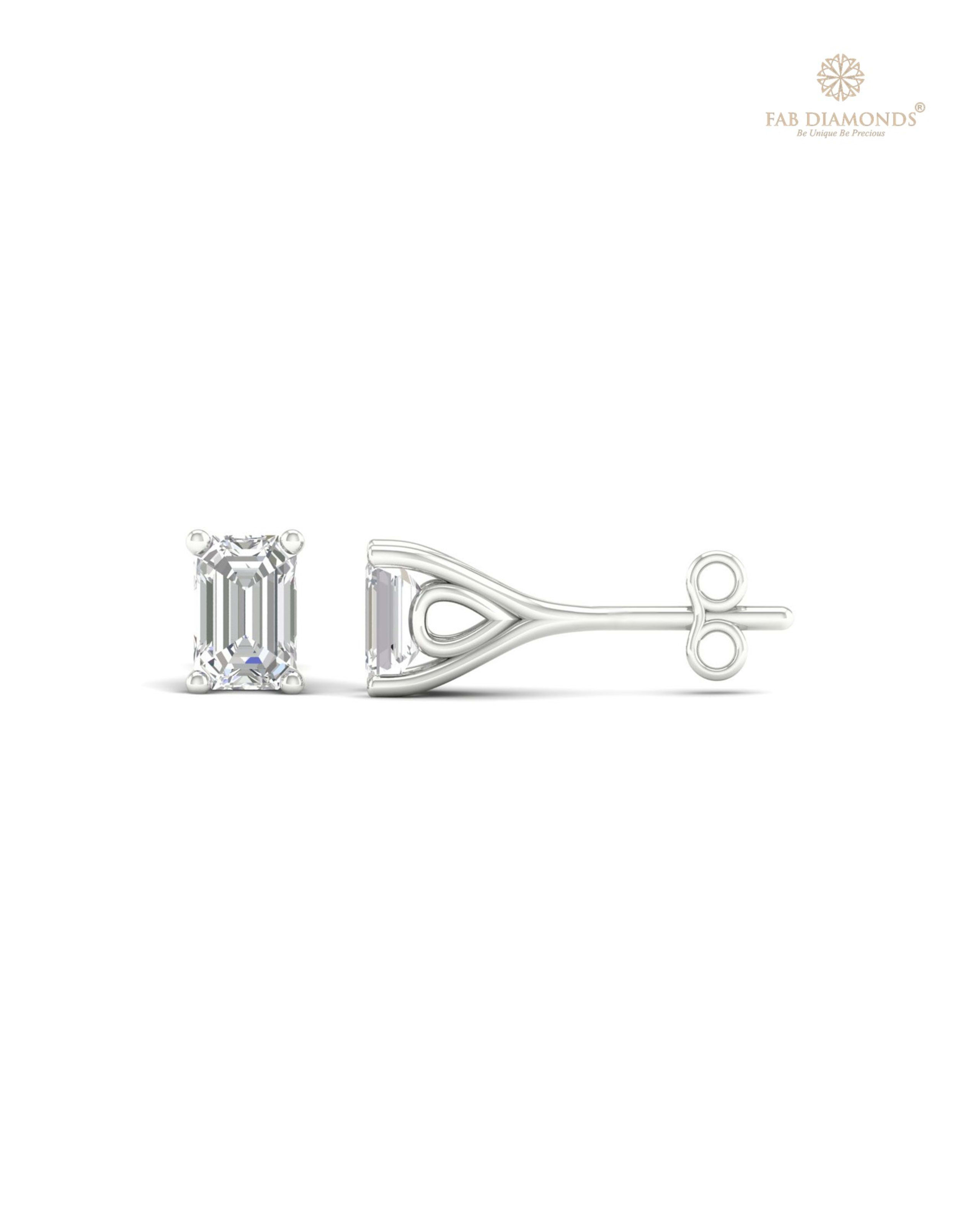 The ES00604 Classic Solitaire Diamond Studs (0.66 Cts) on white atelier plate with FAB hallmark