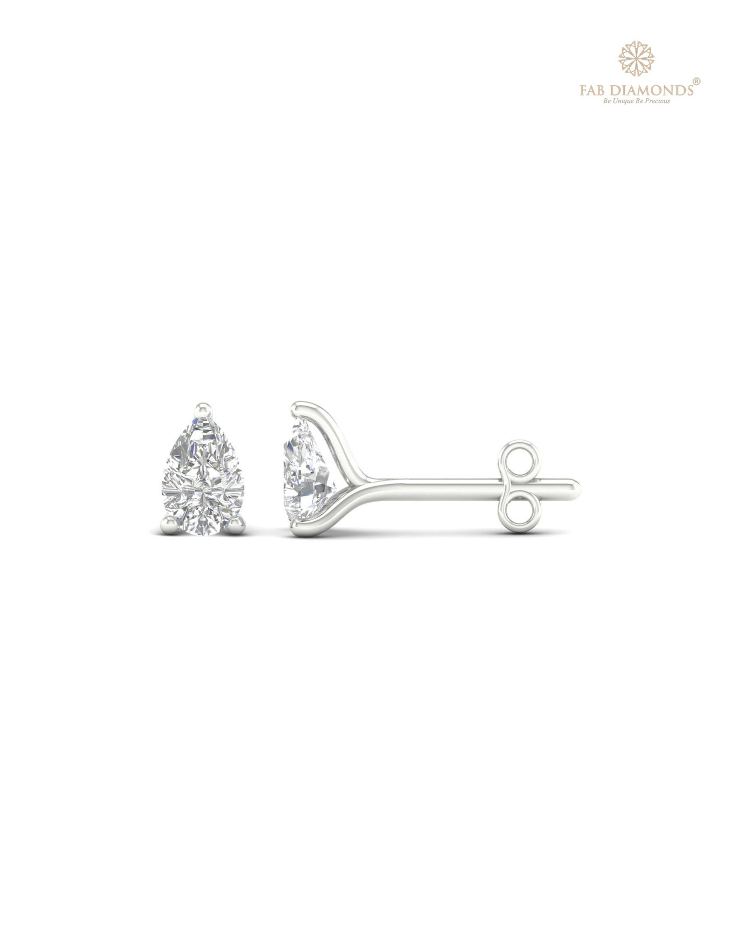 The ES00608 Classic Solitaire Diamond Studs (0.54 Cts) on white atelier plate with FAB hallmark