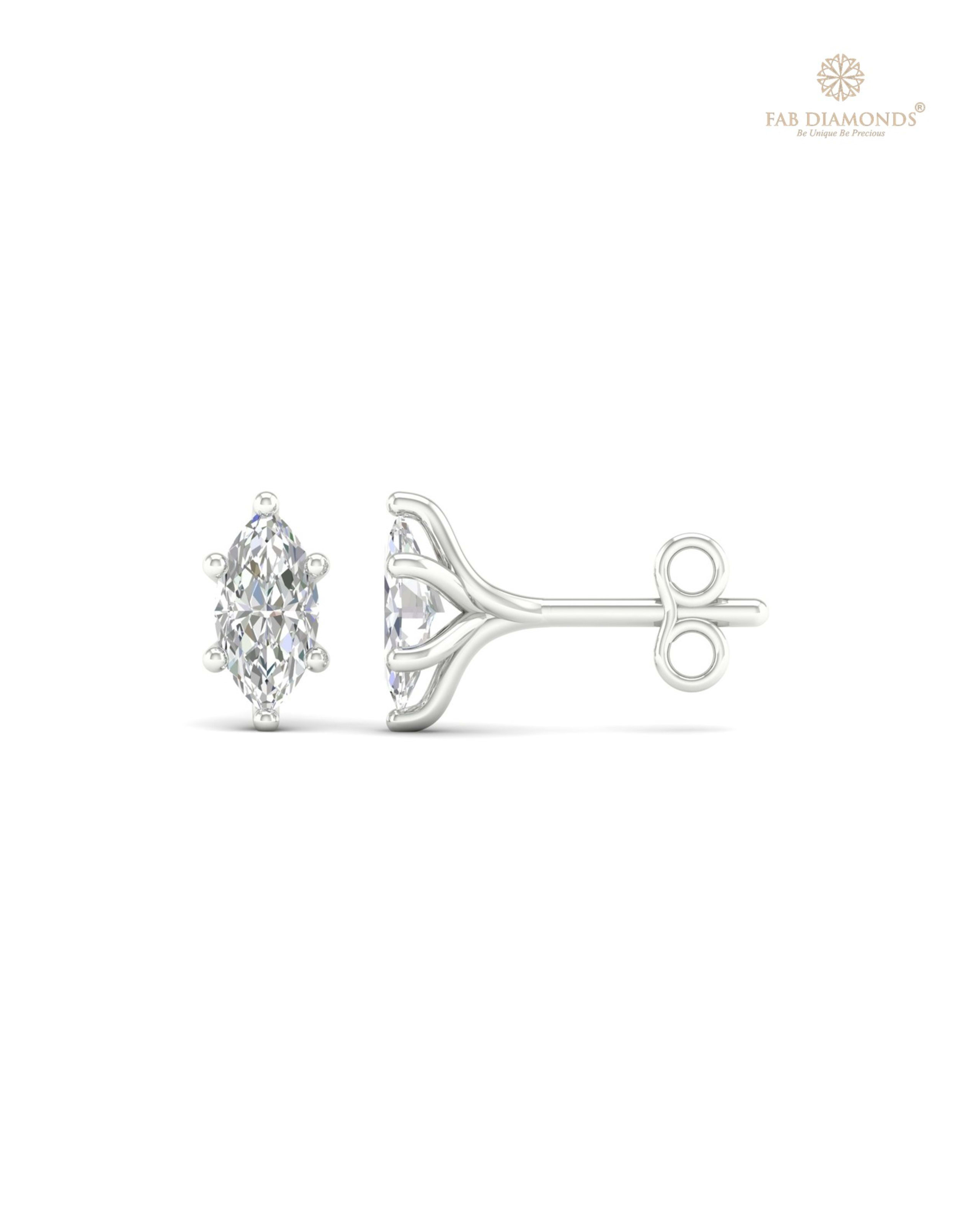 The ES00610 Classic Solitaire Diamond Studs (0.70 Cts) on white atelier plate with FAB hallmark