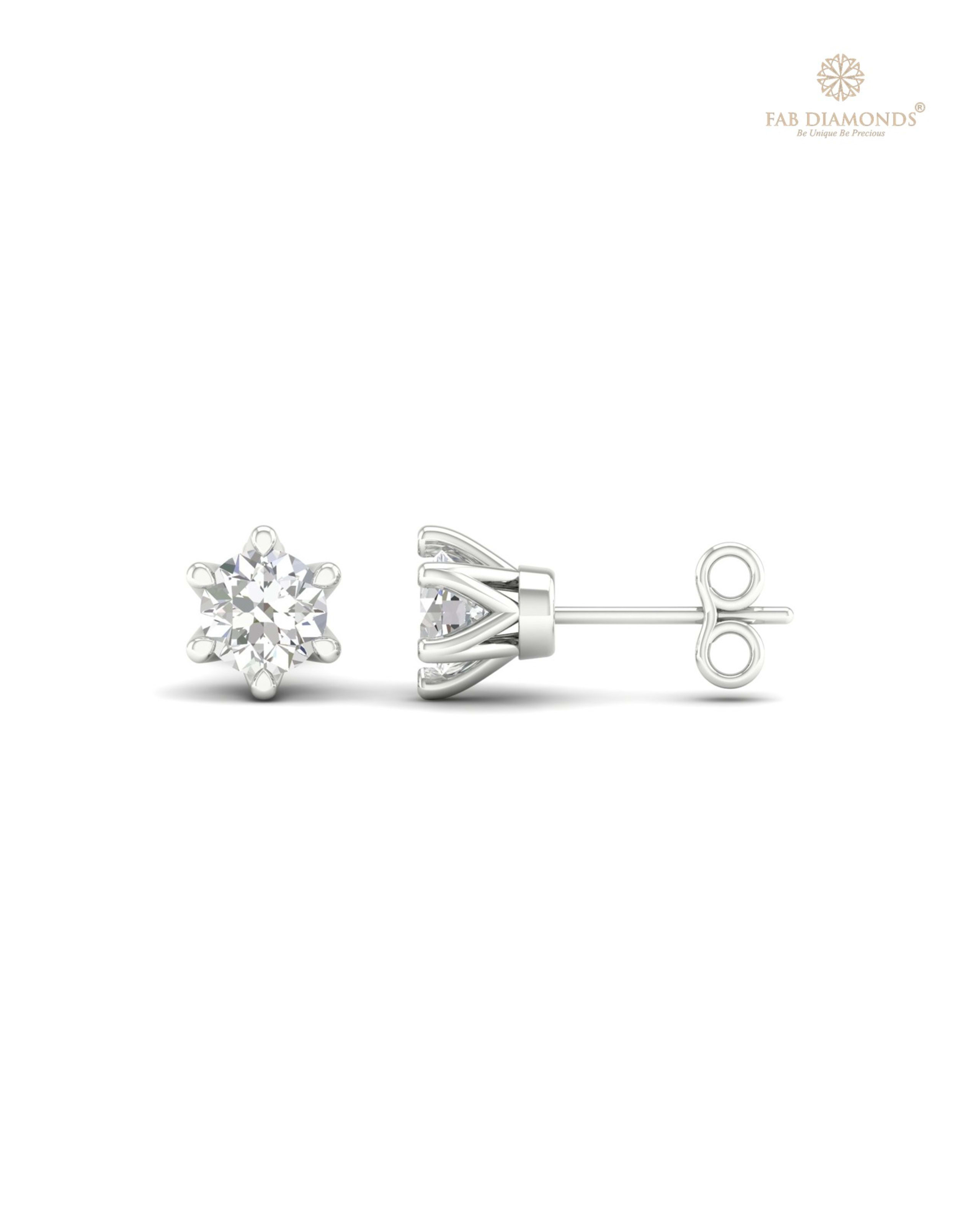 The ES00696 Classic Solitaire Diamond Studs (0.20 Cts) on white atelier plate with FAB hallmark