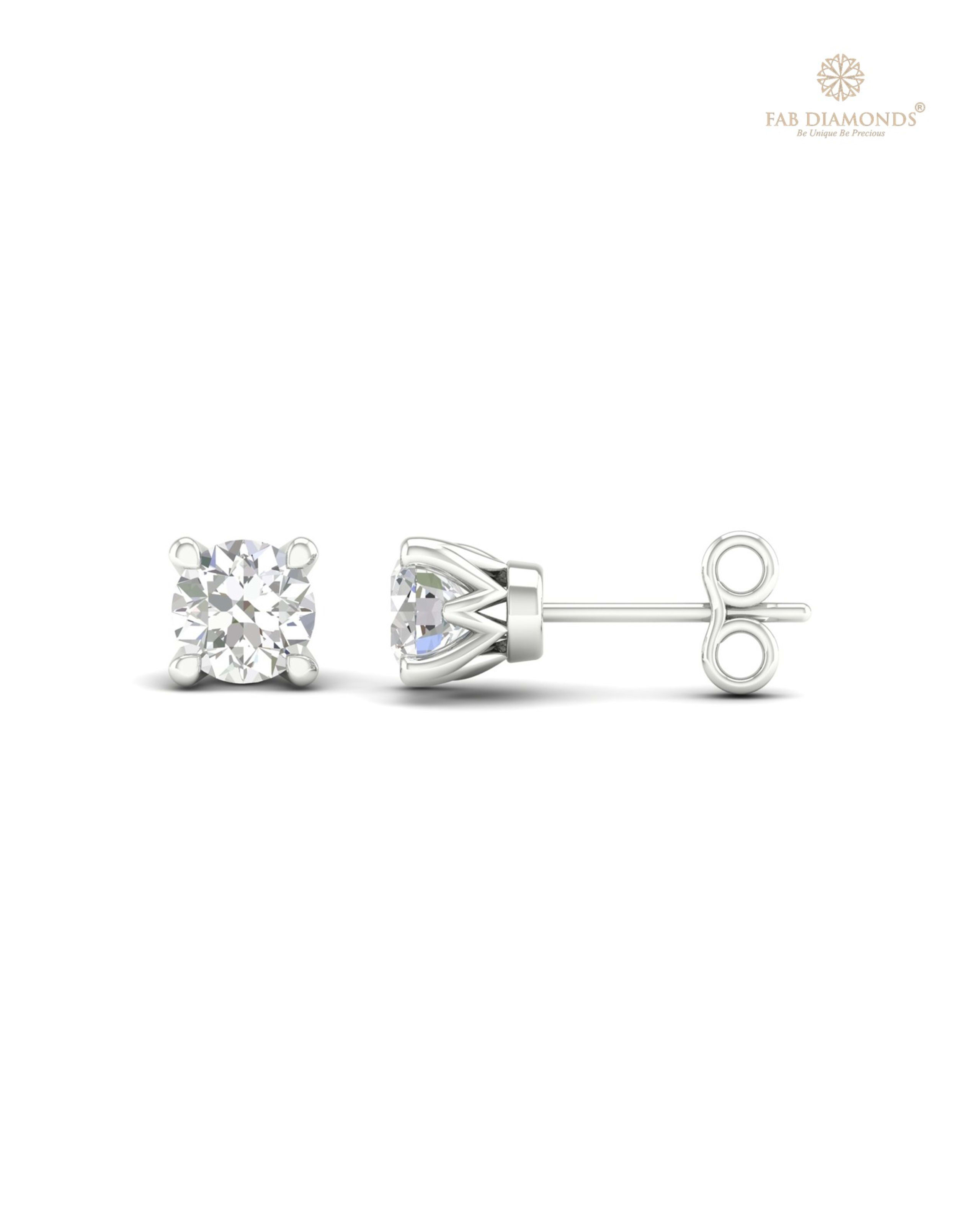 The ES00703 Classic Solitaire Diamond Studs (0.29 Cts) on white atelier plate with FAB hallmark