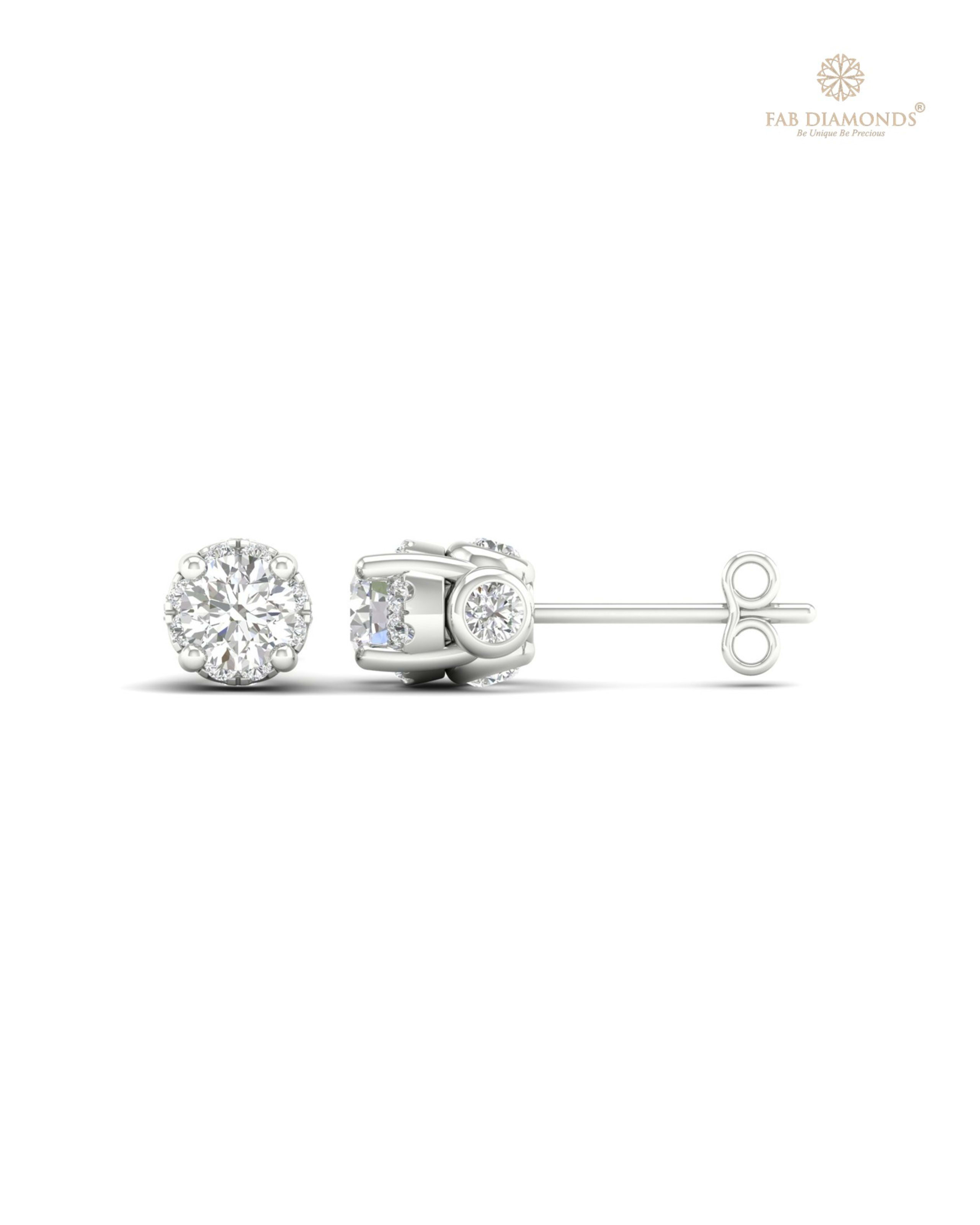 The ES00715 Diamond Halo Diamond Studs (0.49 Cts) on white atelier plate with FAB hallmark
