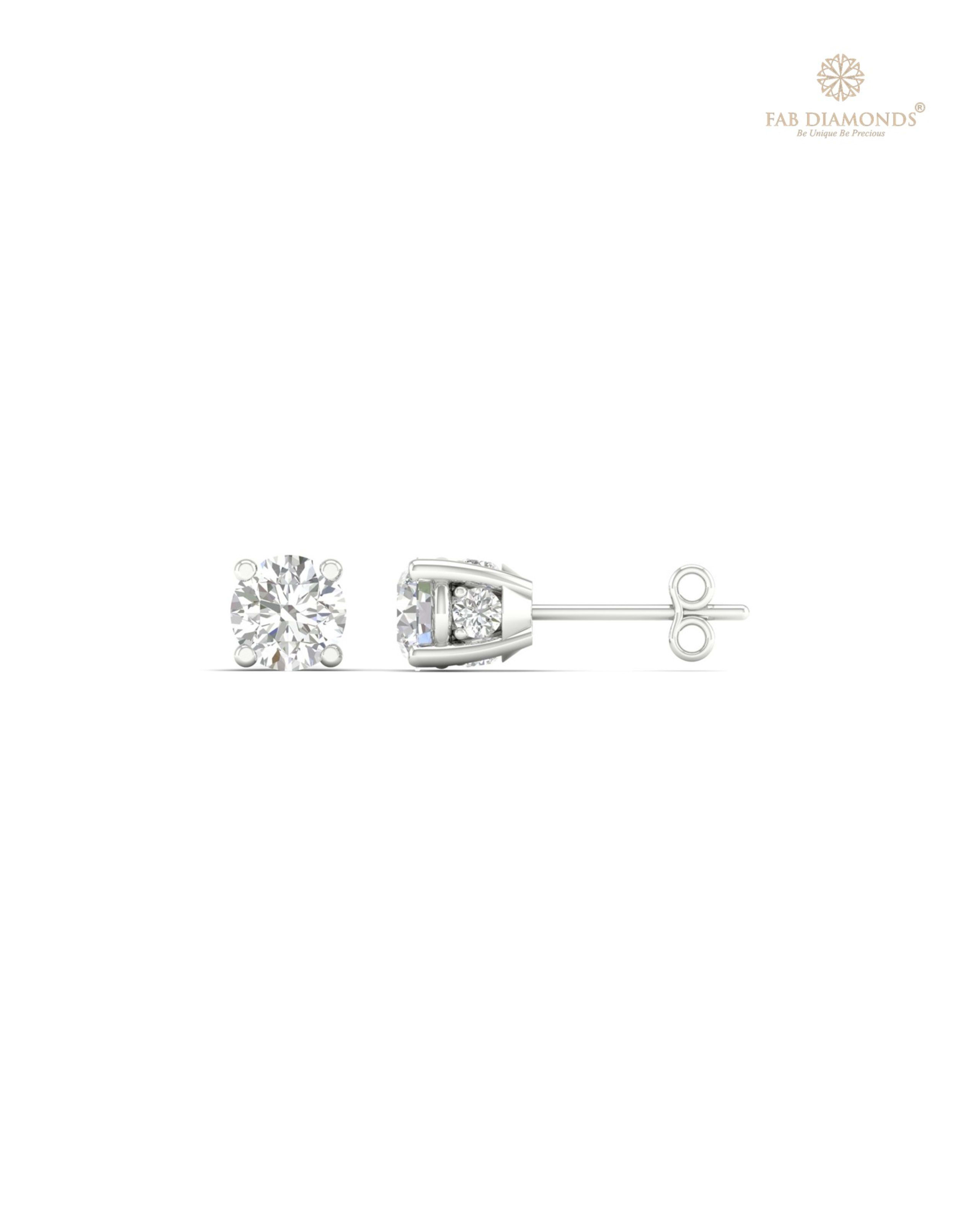 The ES00730 Diamond Halo Diamond Studs (0.50 Cts) on white atelier plate with FAB hallmark