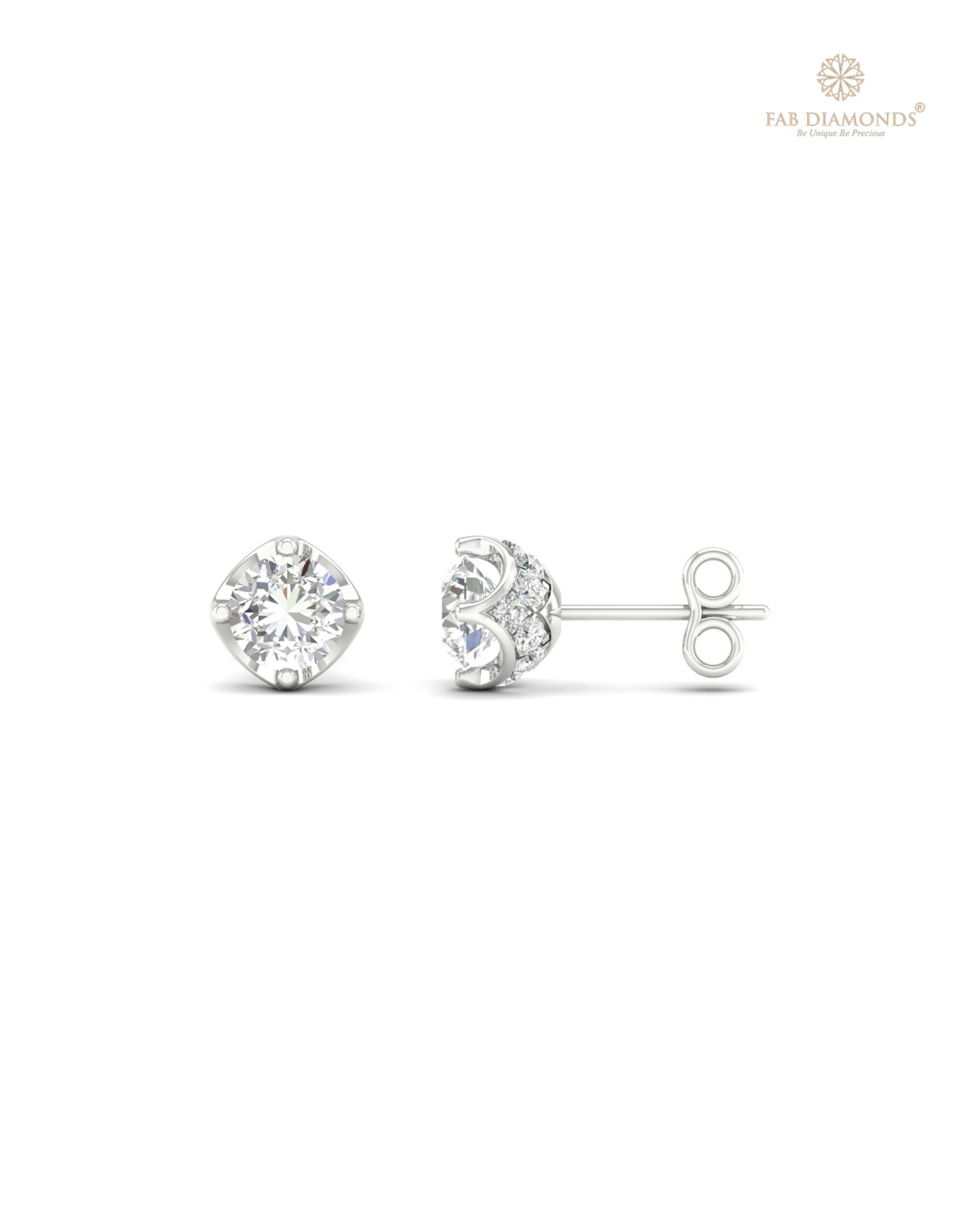 The ES00731 Diamond Halo Diamond Studs (1.00 Cts) on white atelier plate with FAB hallmark