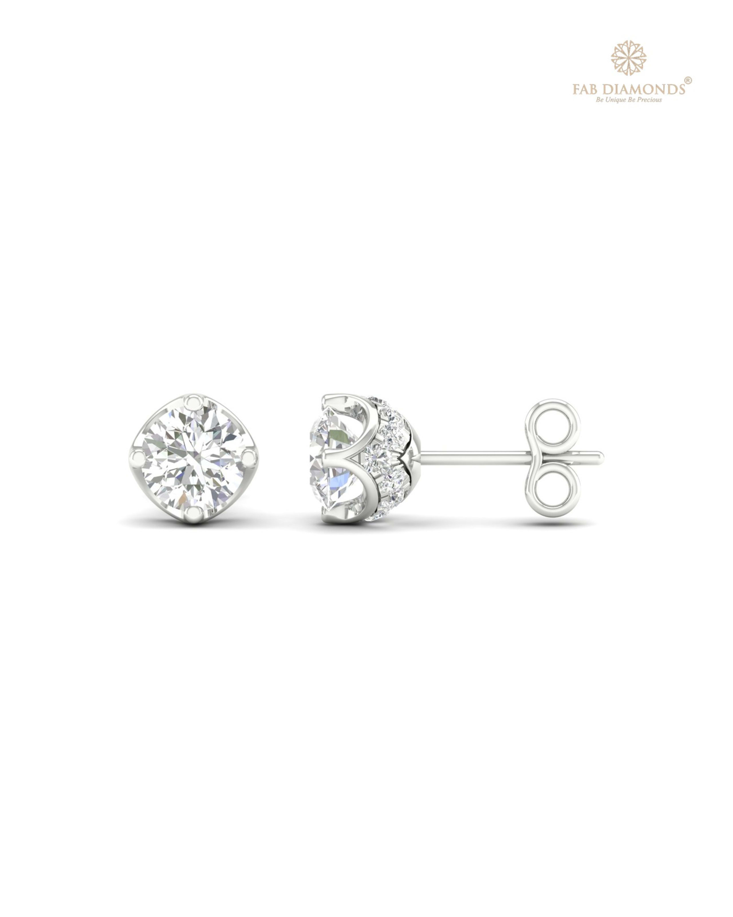 The ES00732 Diamond Halo Diamond Studs (0.50 Cts) on white atelier plate with FAB hallmark