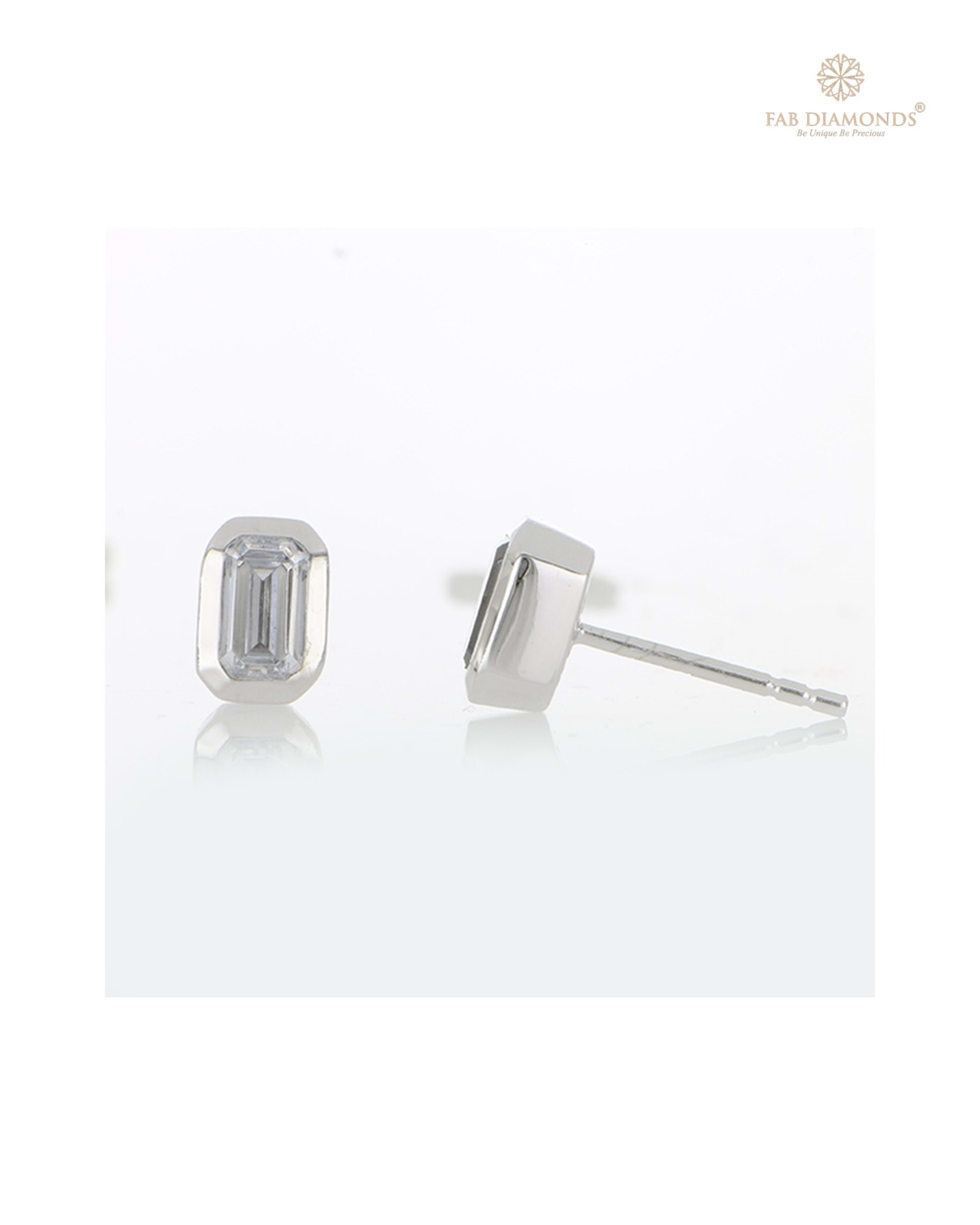 The ES00870 Classic Solitaire Diamond Studs (0.50 Cts) on white atelier plate with FAB hallmark