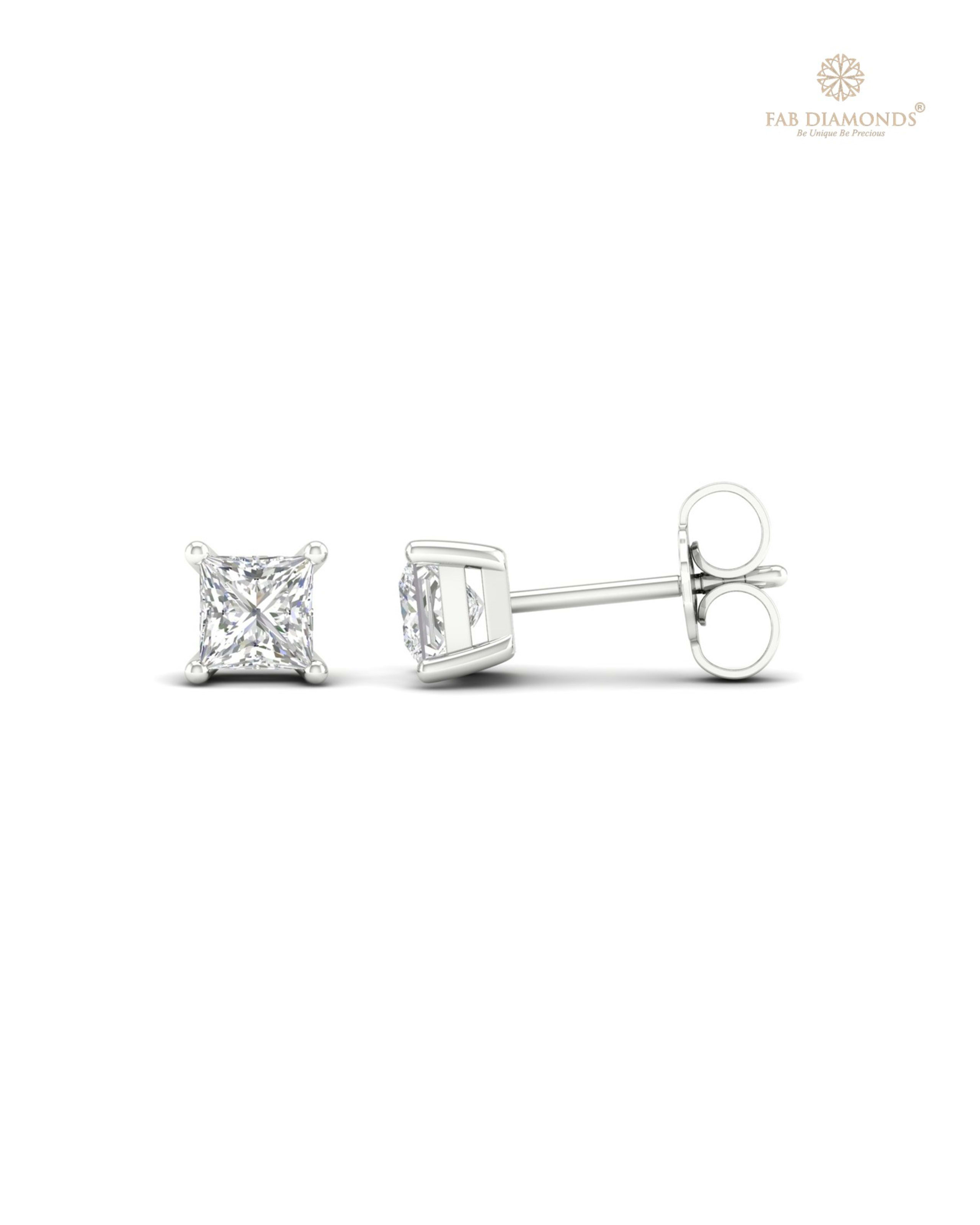 The ES01239 Classic Solitaire Diamond Studs (0.84 Cts) on white atelier plate with FAB hallmark