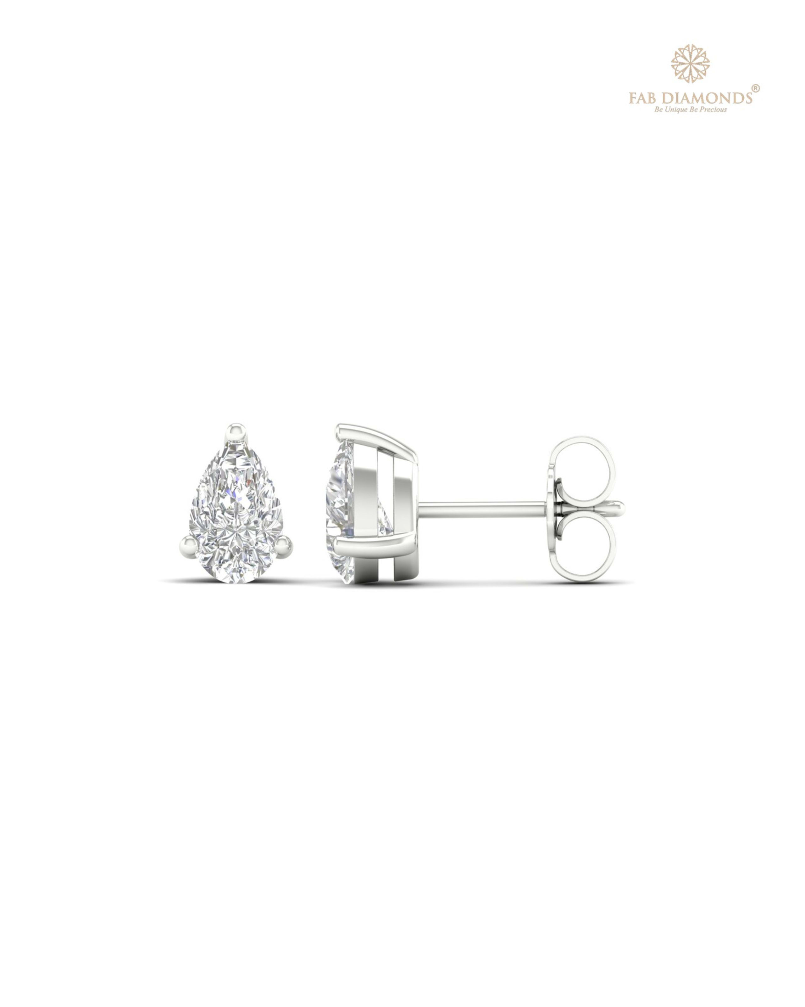 The ES01376 Classic Solitaire Diamond Studs (1.04 Cts) on white atelier plate with FAB hallmark