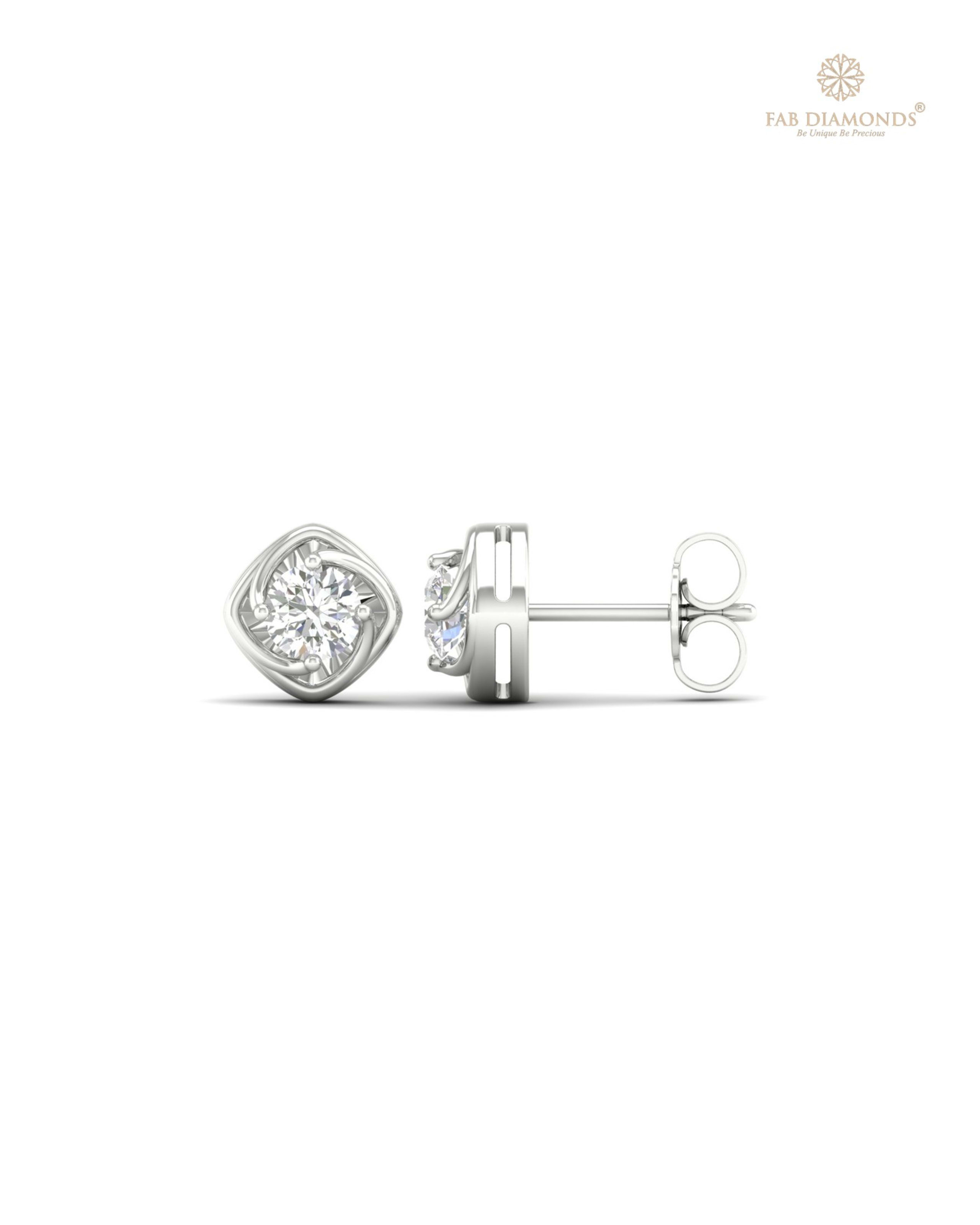 The ES01429 Classic Solitaire Diamond Studs (0.50 Cts) on white atelier plate with FAB hallmark
